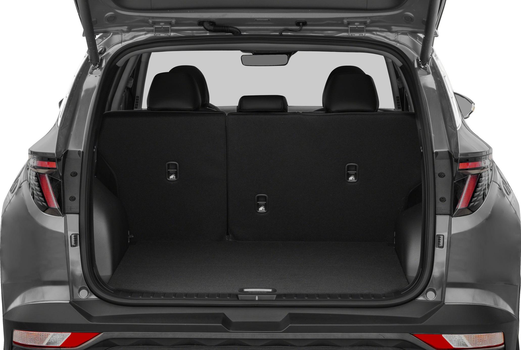 Open rear cargo space of SUV with upright rear seats and visible headrests