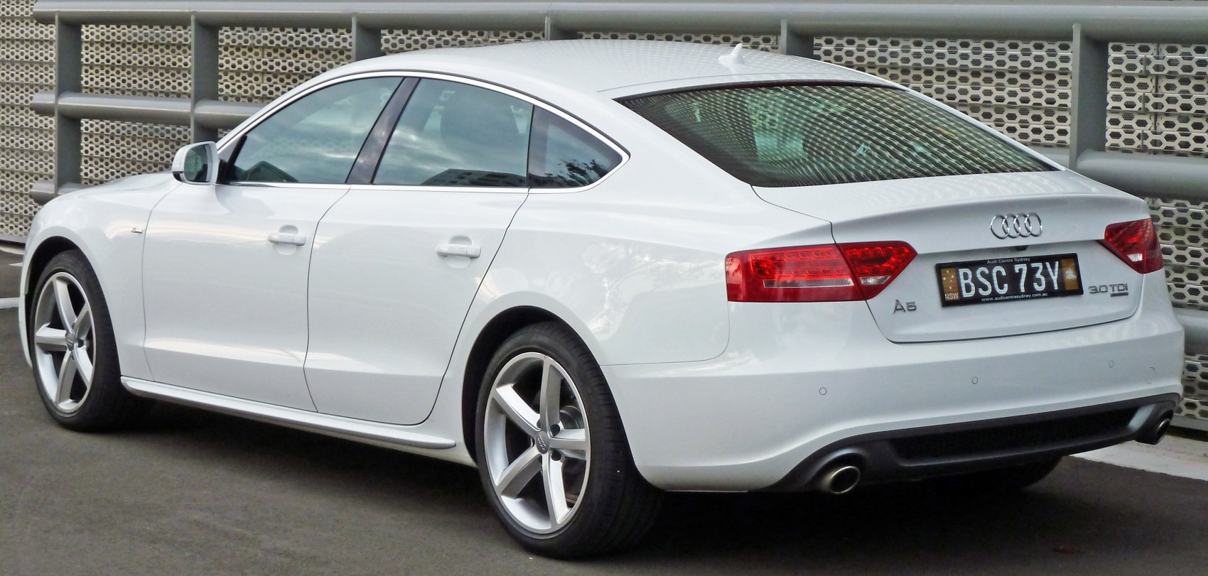 Rear side view with LED taillights and five-spoke alloy wheels