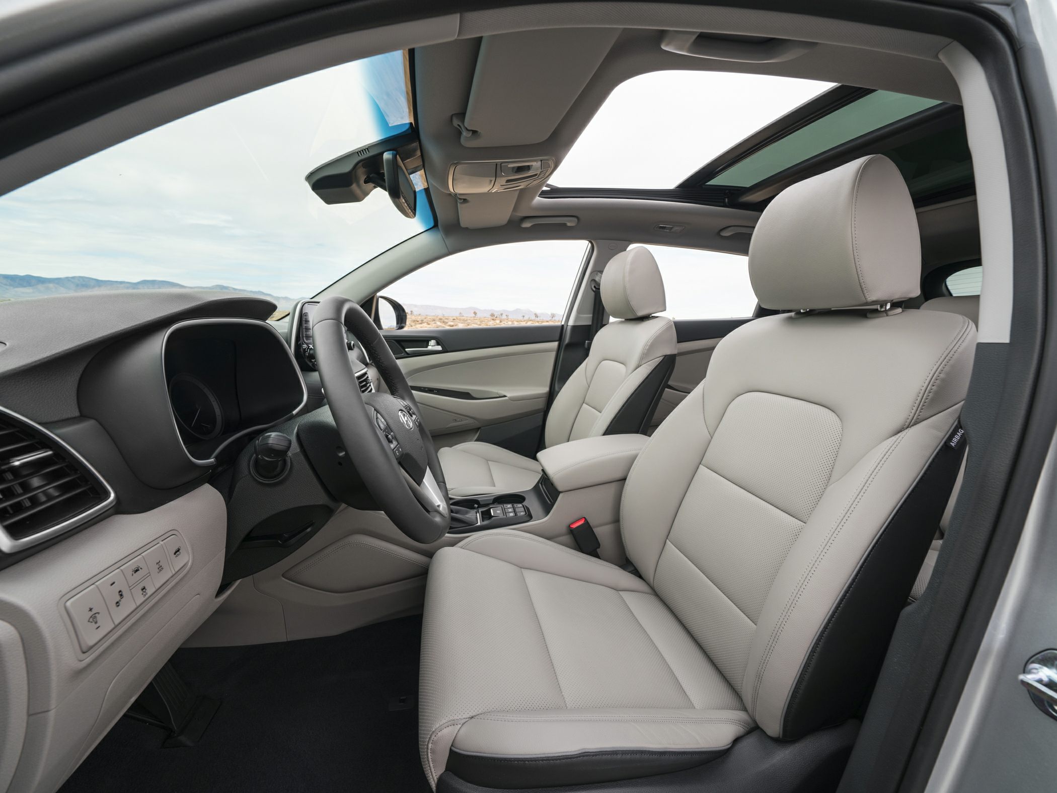 Leather seats and panoramic sunroof in spacious vehicle interior