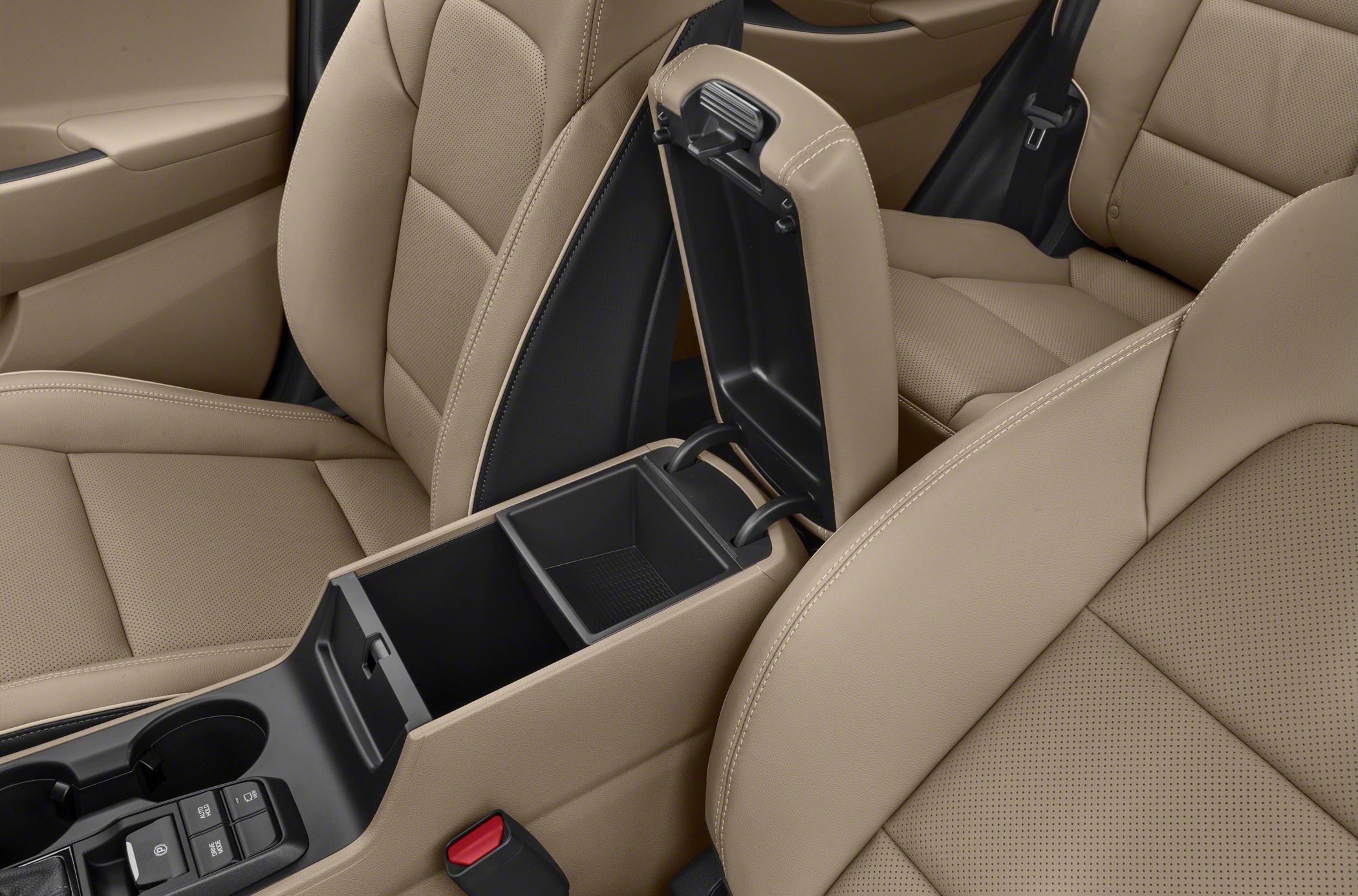 Beige perforated leather seats and open center console storage compartment