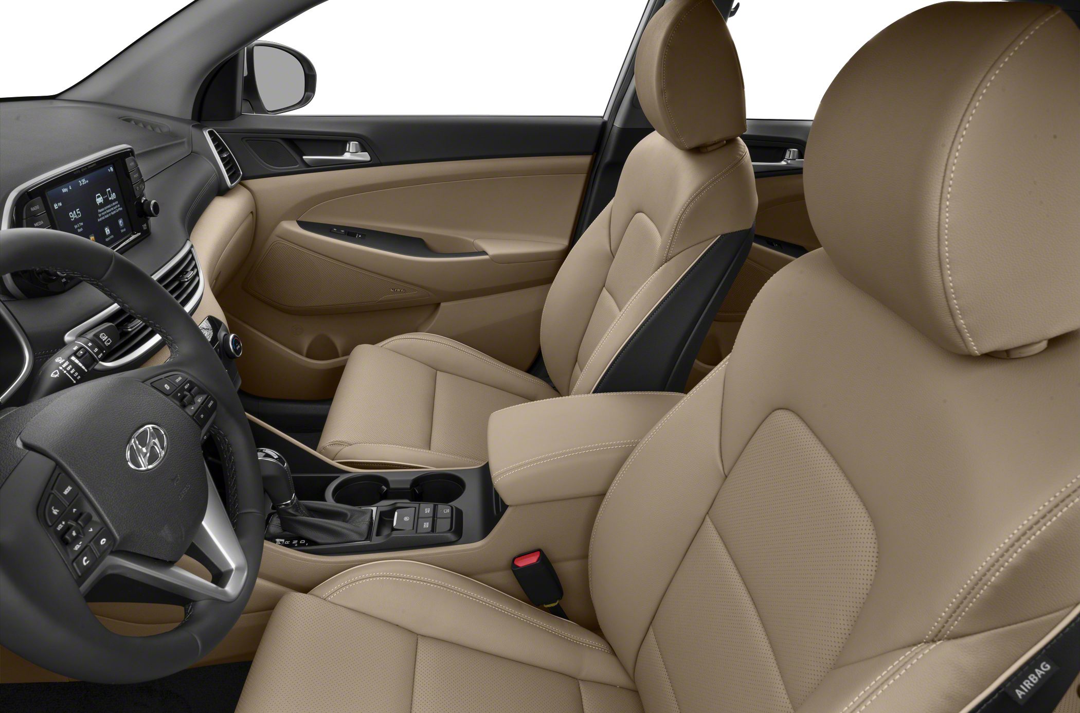 Beige leather front seats and dashboard interior with steering wheel and center console.