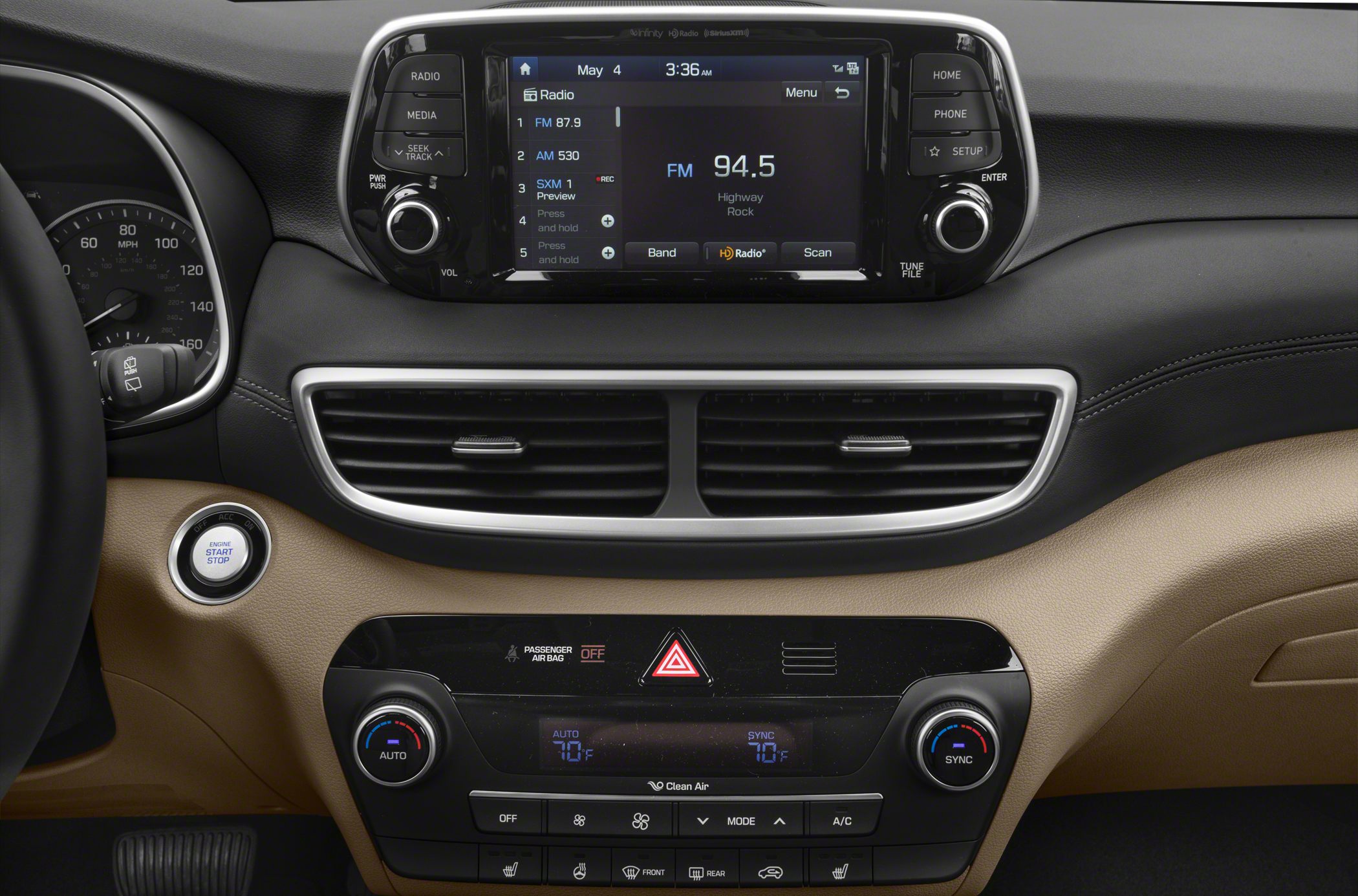 Infotainment touchscreen and dual-zone climate controls on dashboard