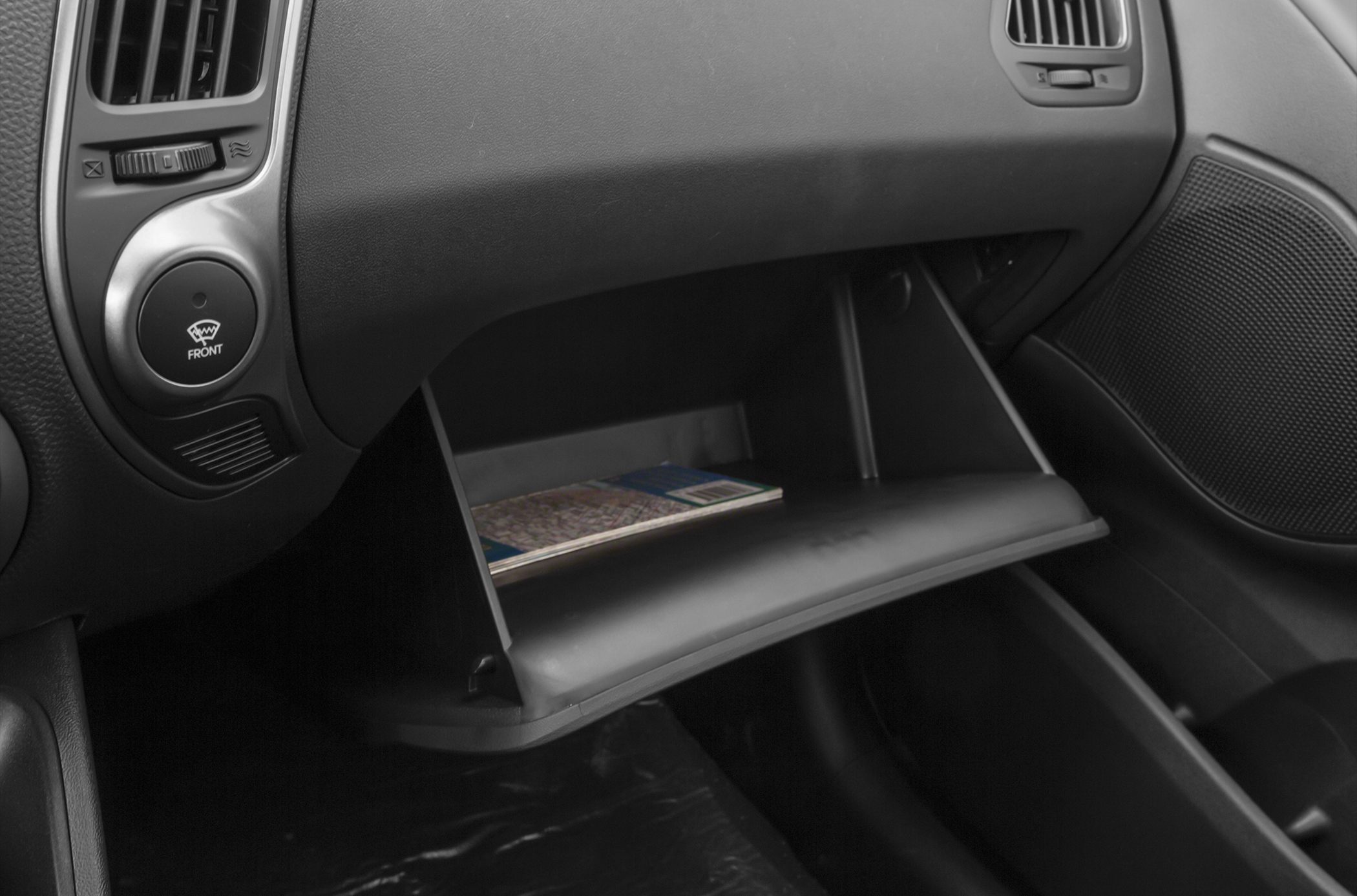 Glove box with map and dashboard air vents