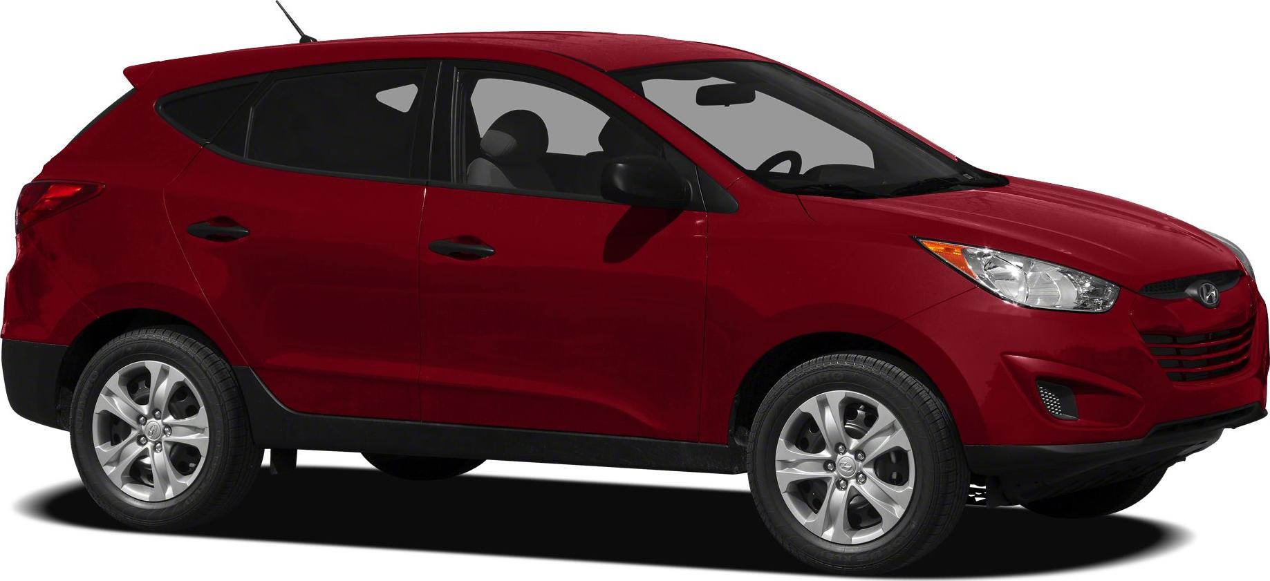 Side profile of red SUV with alloy wheels and sleek headlights