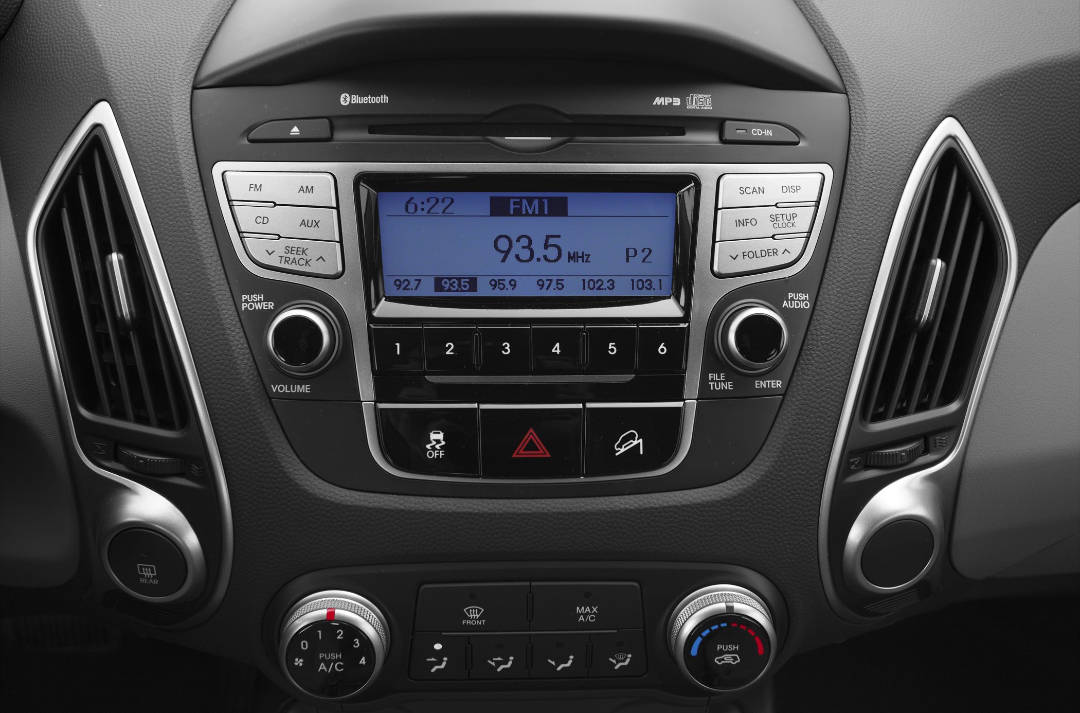Radio unit and climate control panel with knobs and buttons