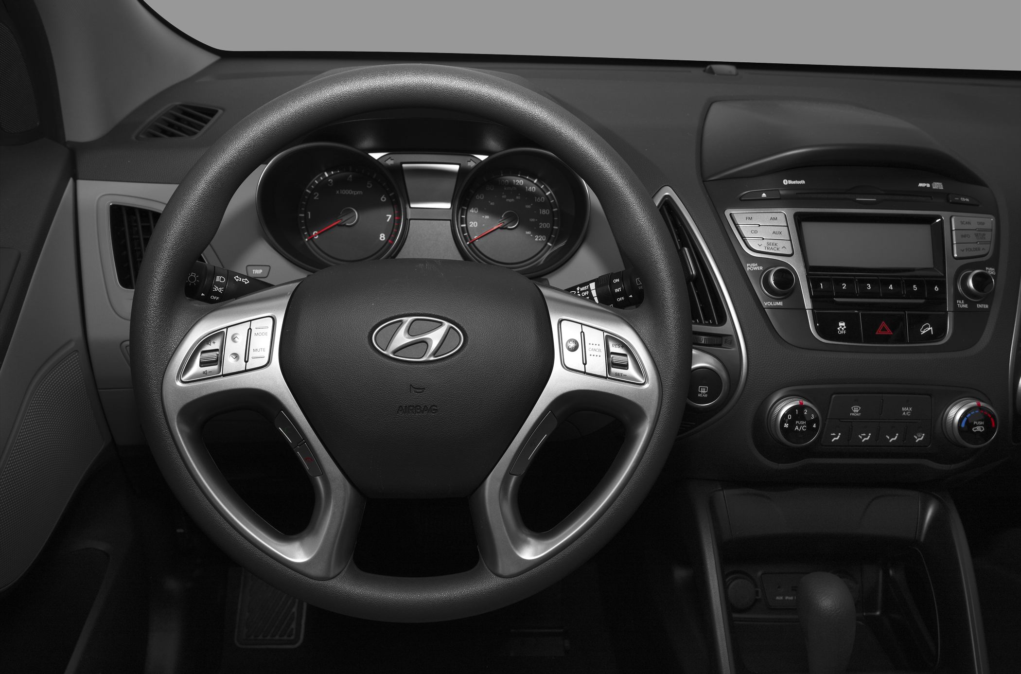 Steering wheel with controls and dashboard infotainment system