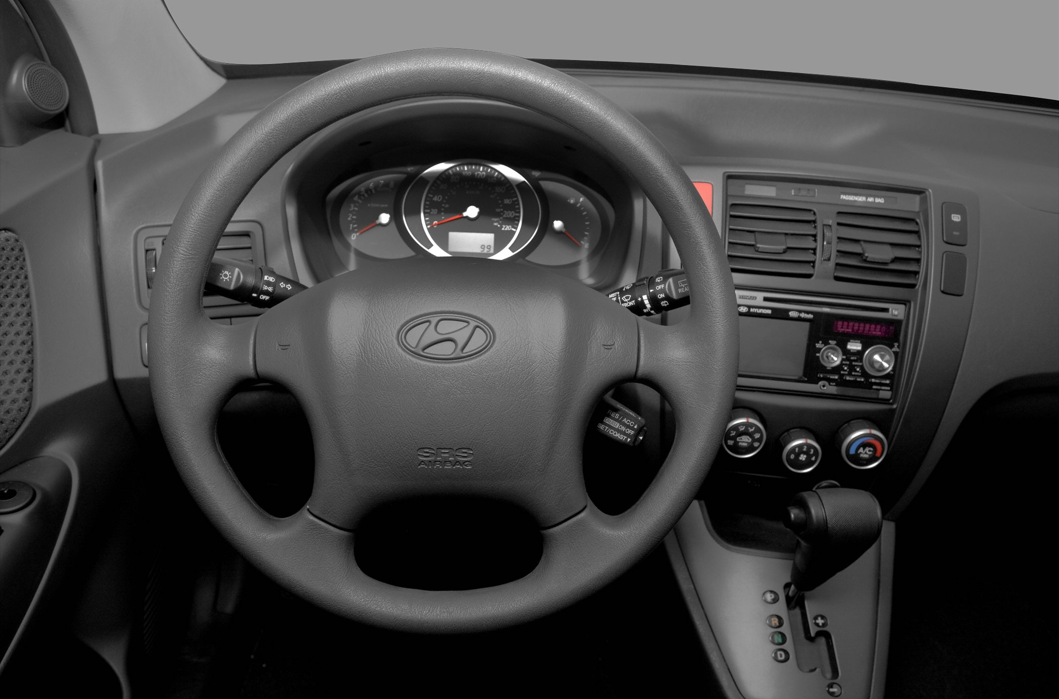 Steering wheel and dashboard with controls and gear shift