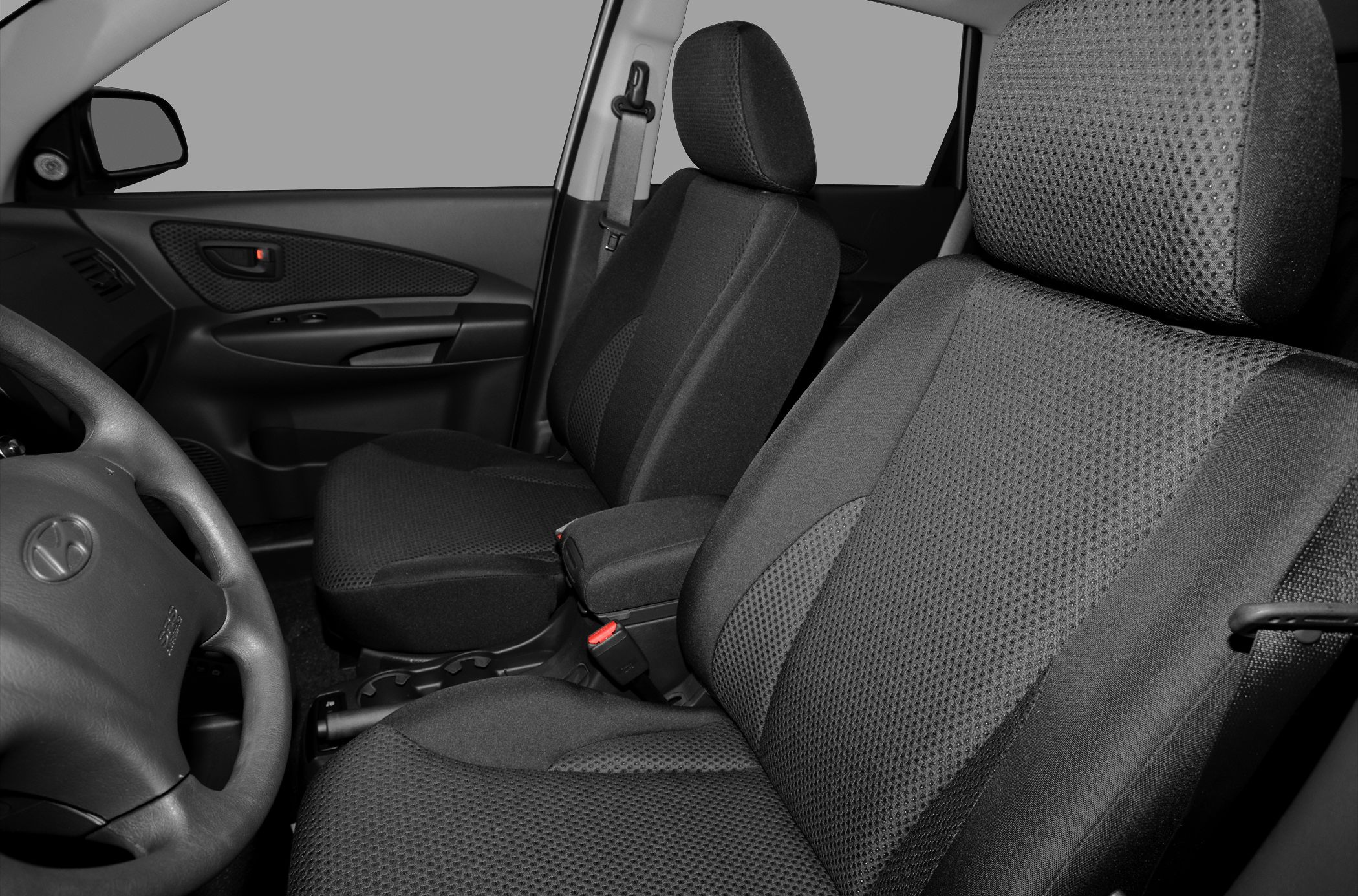 Front interior seats with black fabric upholstery and ergonomic design