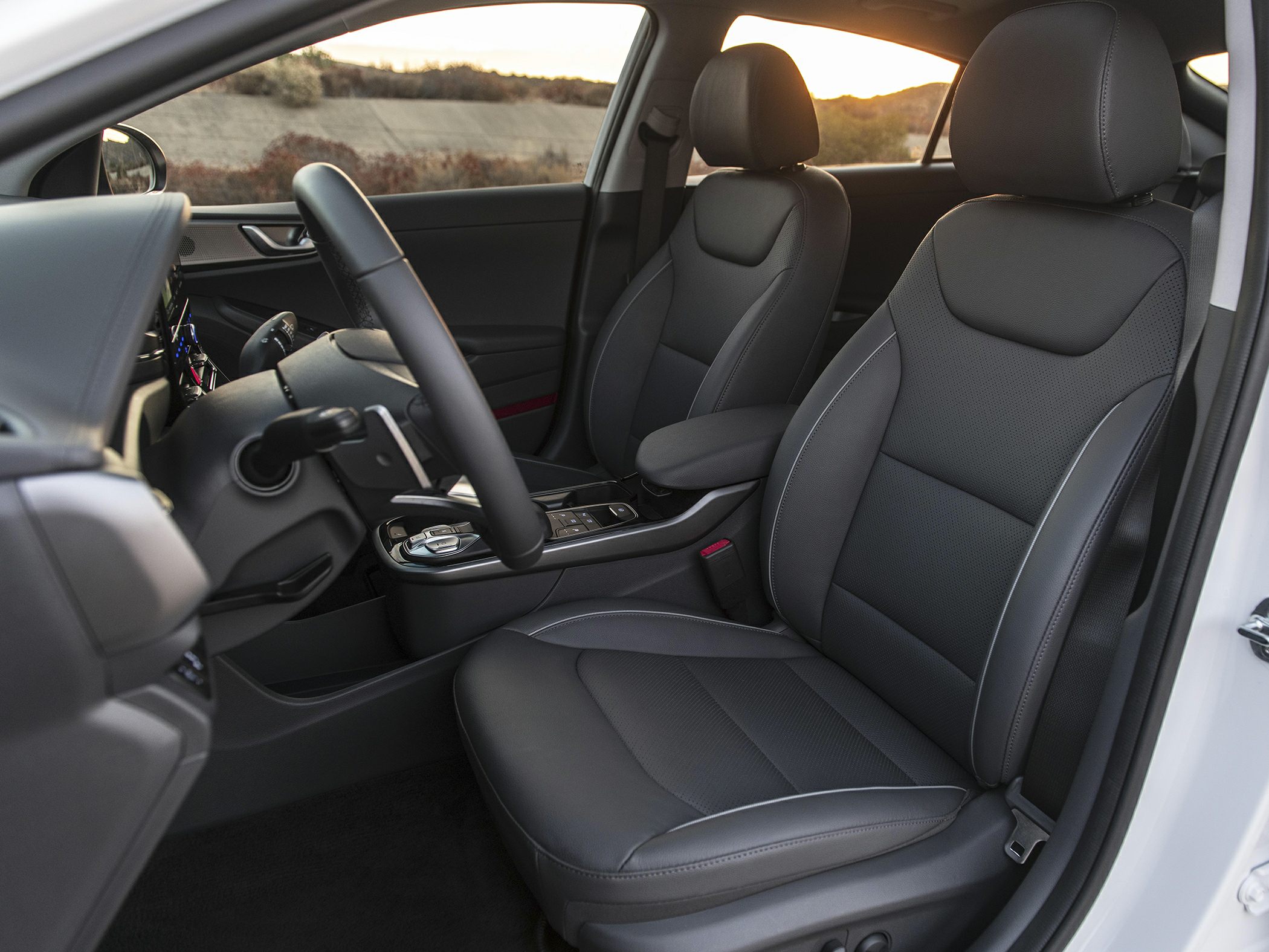 Black leather front seats and steering wheel with center console controls