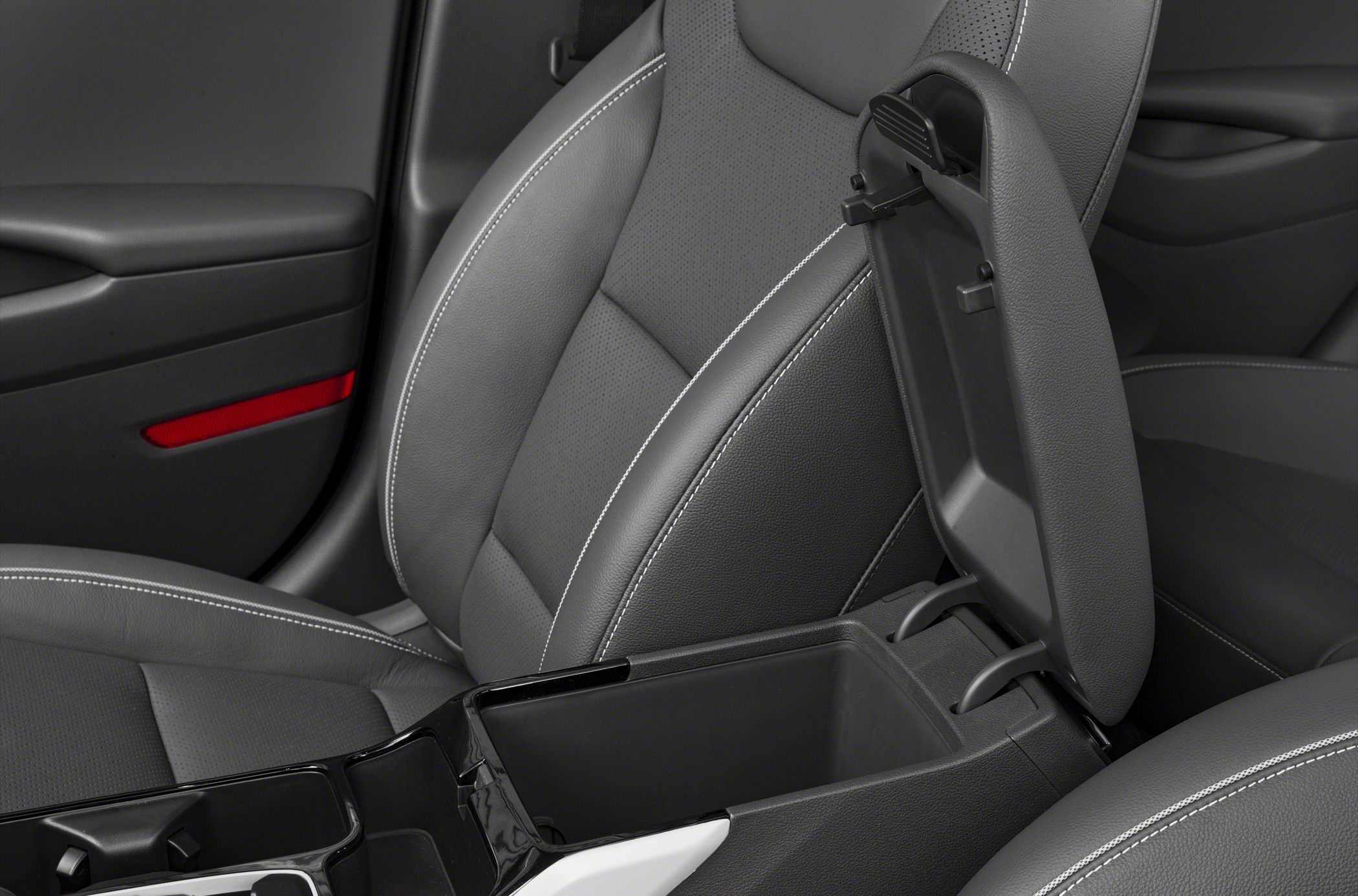 Open center console storage and detailed leather seats with white stitching