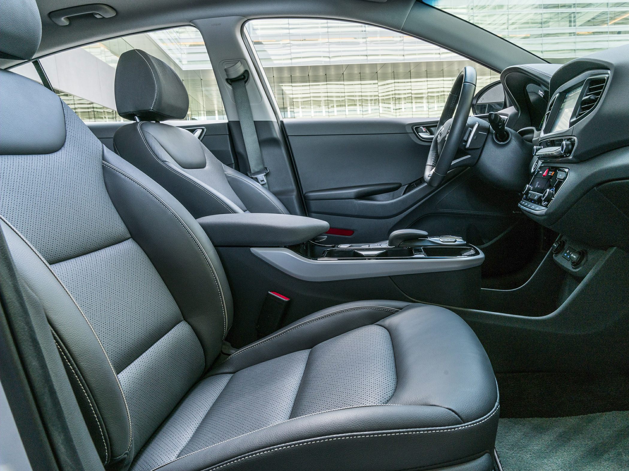 Modern car interior with leather seats and central console
