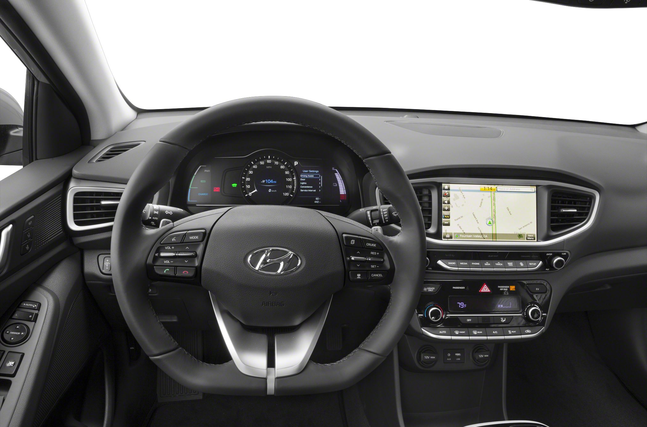 Steering wheel with controls and digital dashboard displaying speed and infotainment system.