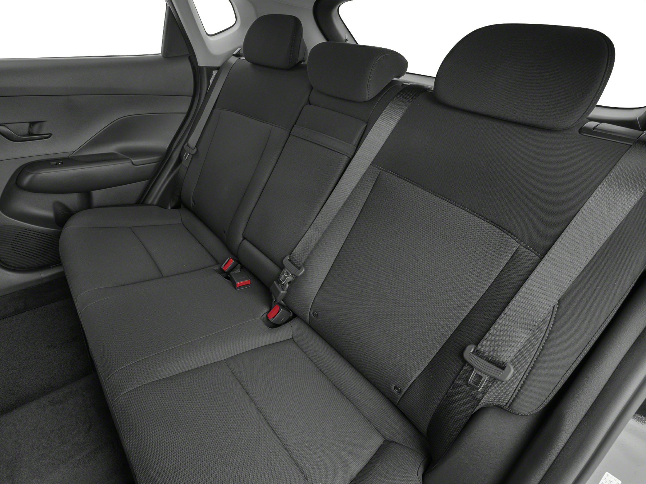 Rear seat interior with black fabric upholstery and seat belts