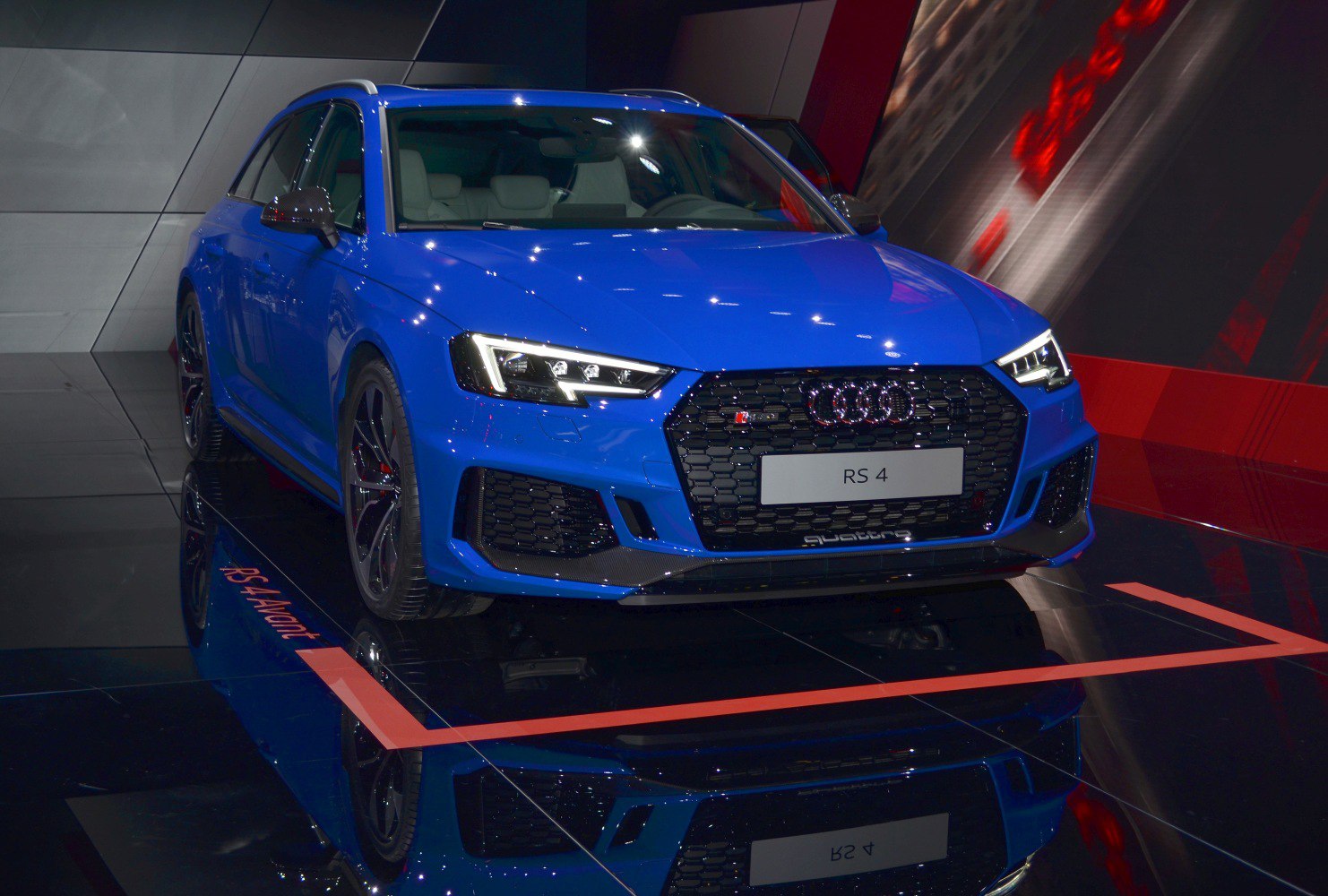 Front view of blue sporty wagon with LED headlights and honeycomb grille