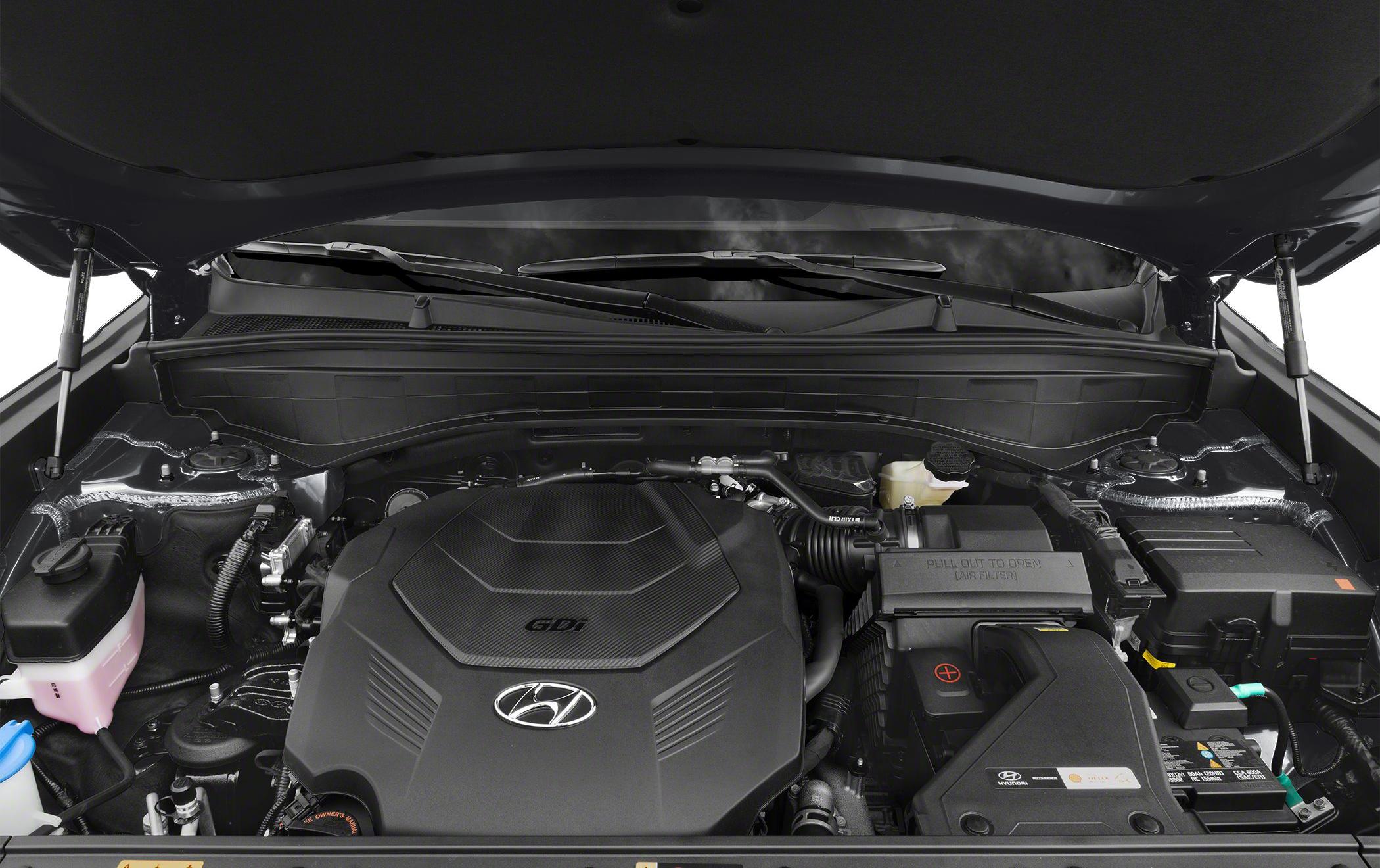 Engine bay of a modern SUV with visible engine cover and components