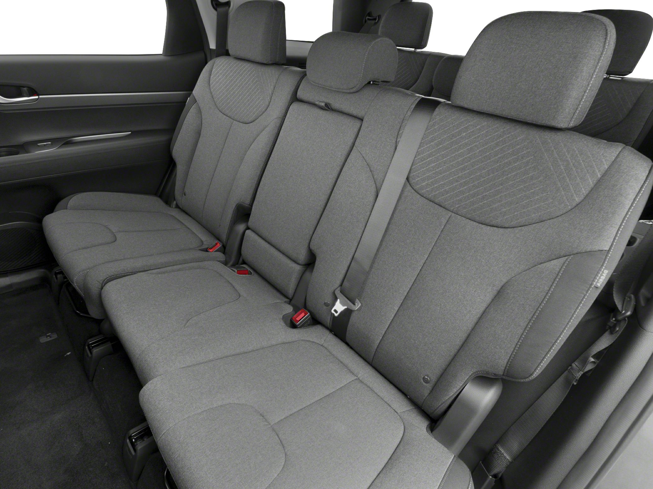 Grey fabric rear passenger seats with headrests and seat belts