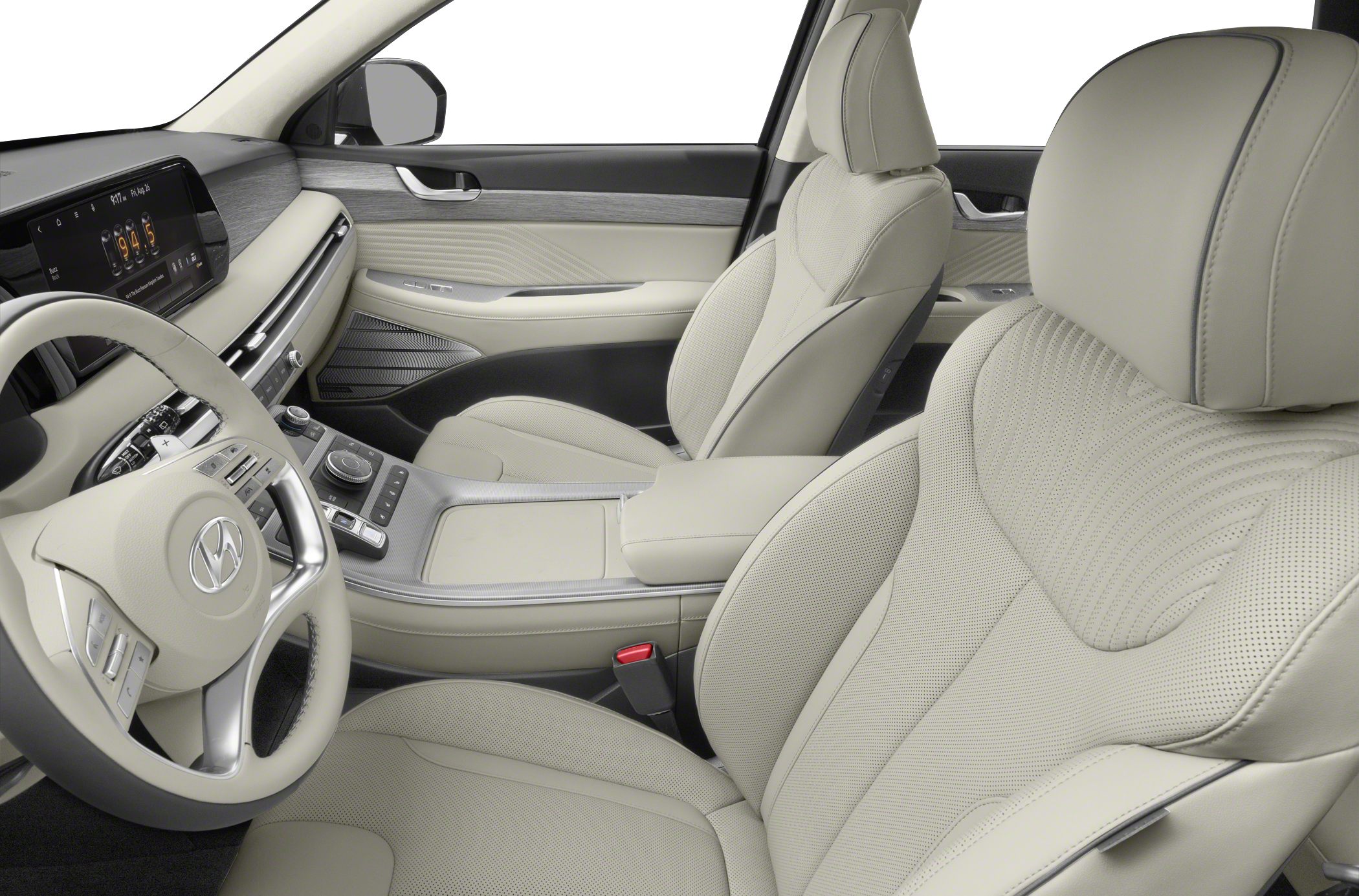 Luxury perforated leather seats and modern infotainment system inside car cabin.