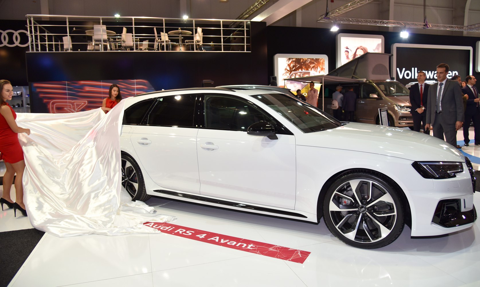 White performance wagon with sporty alloy wheels and sleek side profile