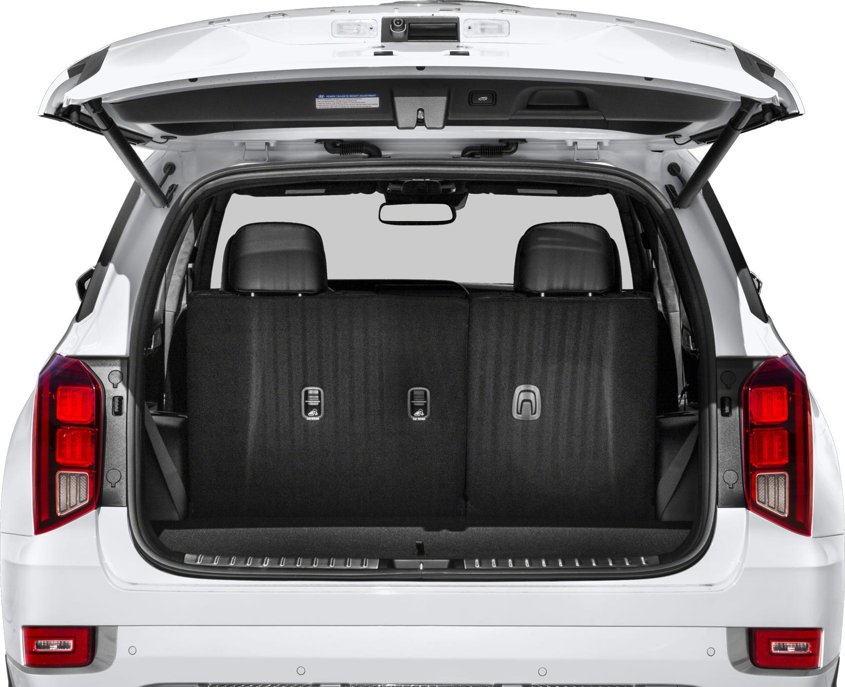 Open trunk showing rear seats and taillights of SUV