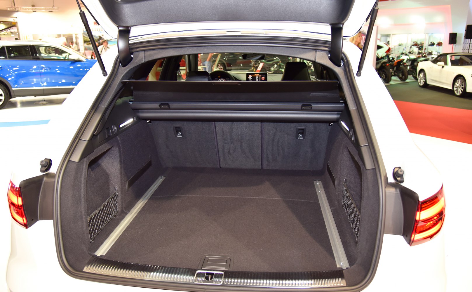 Spacious rear cargo area with side net storage and retractable cover