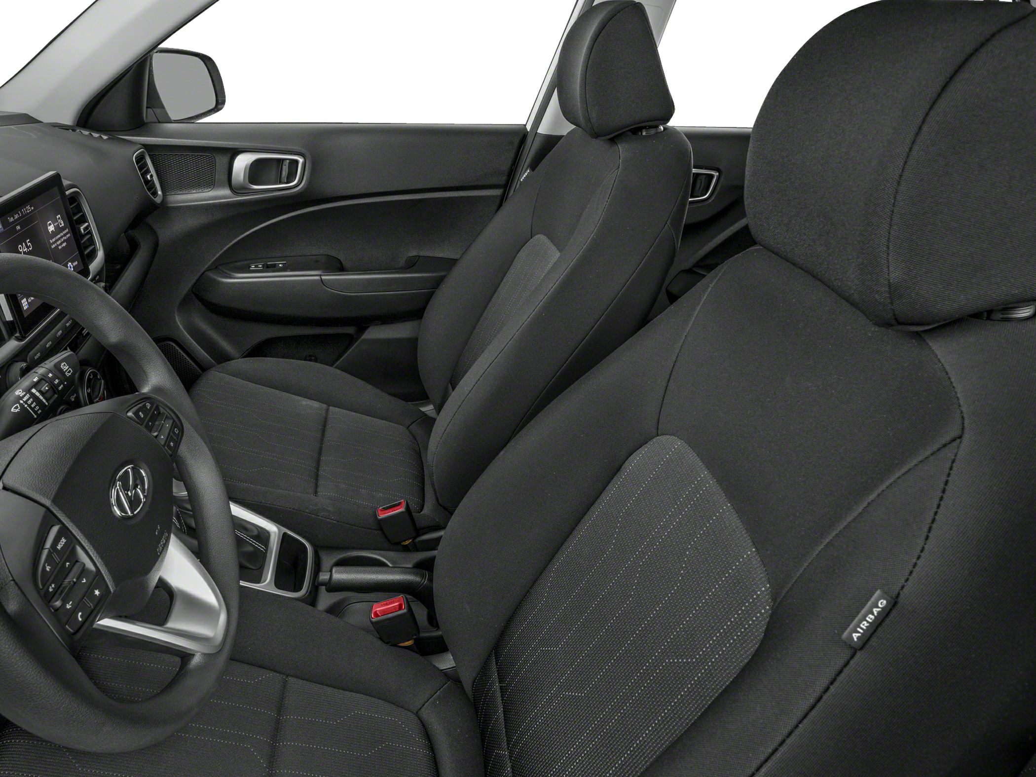 Front seats and dashboard with fabric upholstery and controls