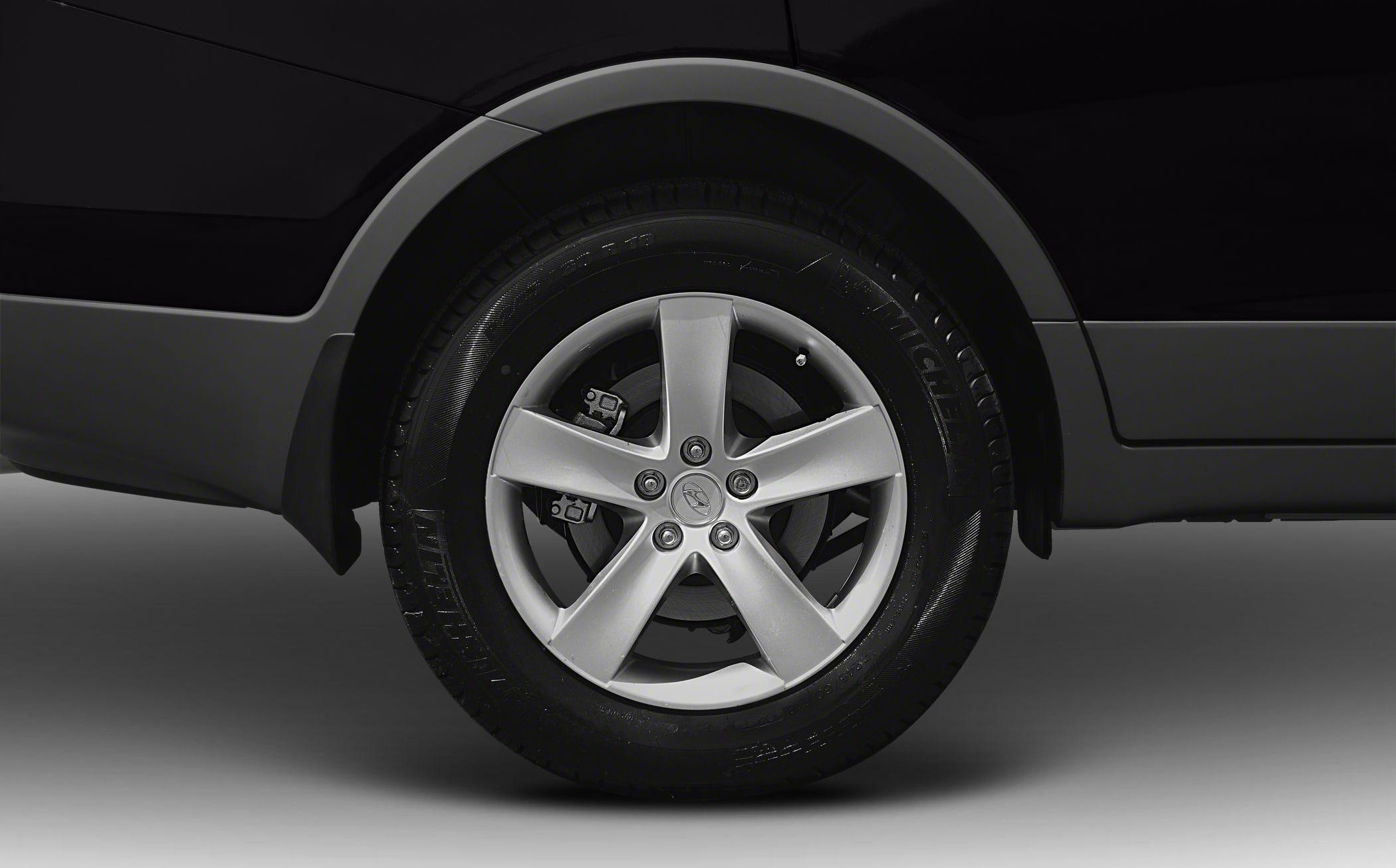 Close-up of alloy wheel with Michelin tire and disc brake.