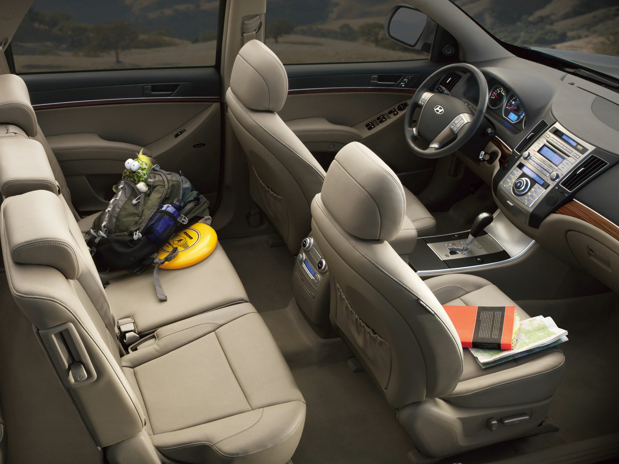Spacious beige leather SUV interior with detailed dashboard and central console