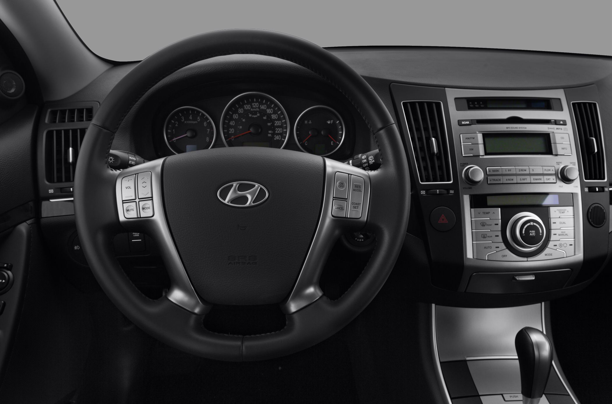 Dashboard and steering wheel with instrument cluster and control buttons