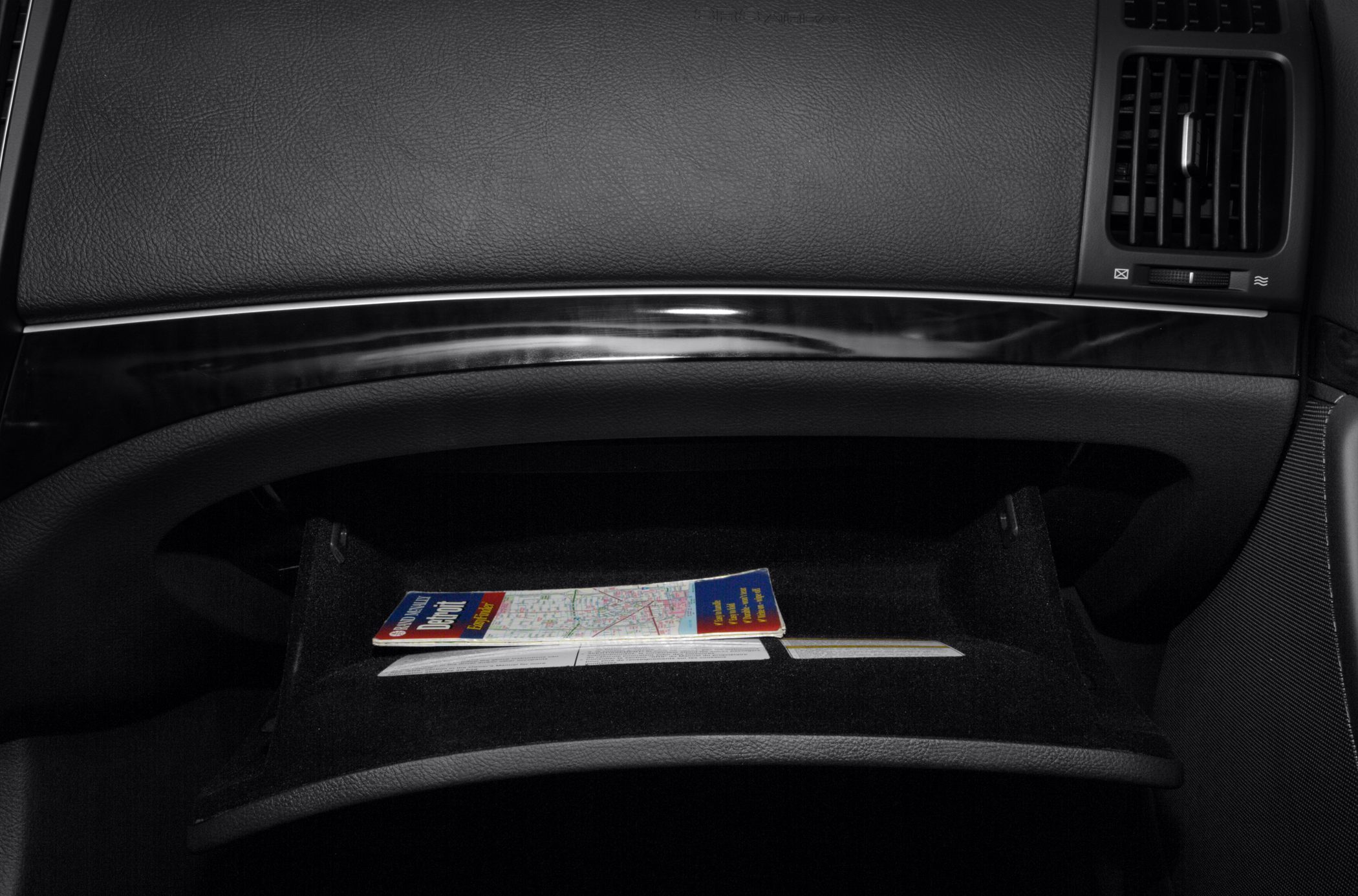 Glove compartment with wood trim dashboard and leather interior