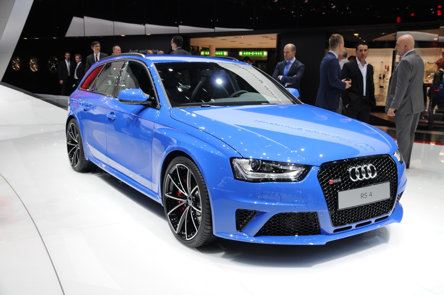 Blue sporty performance wagon with aggressive front grille and alloy wheels