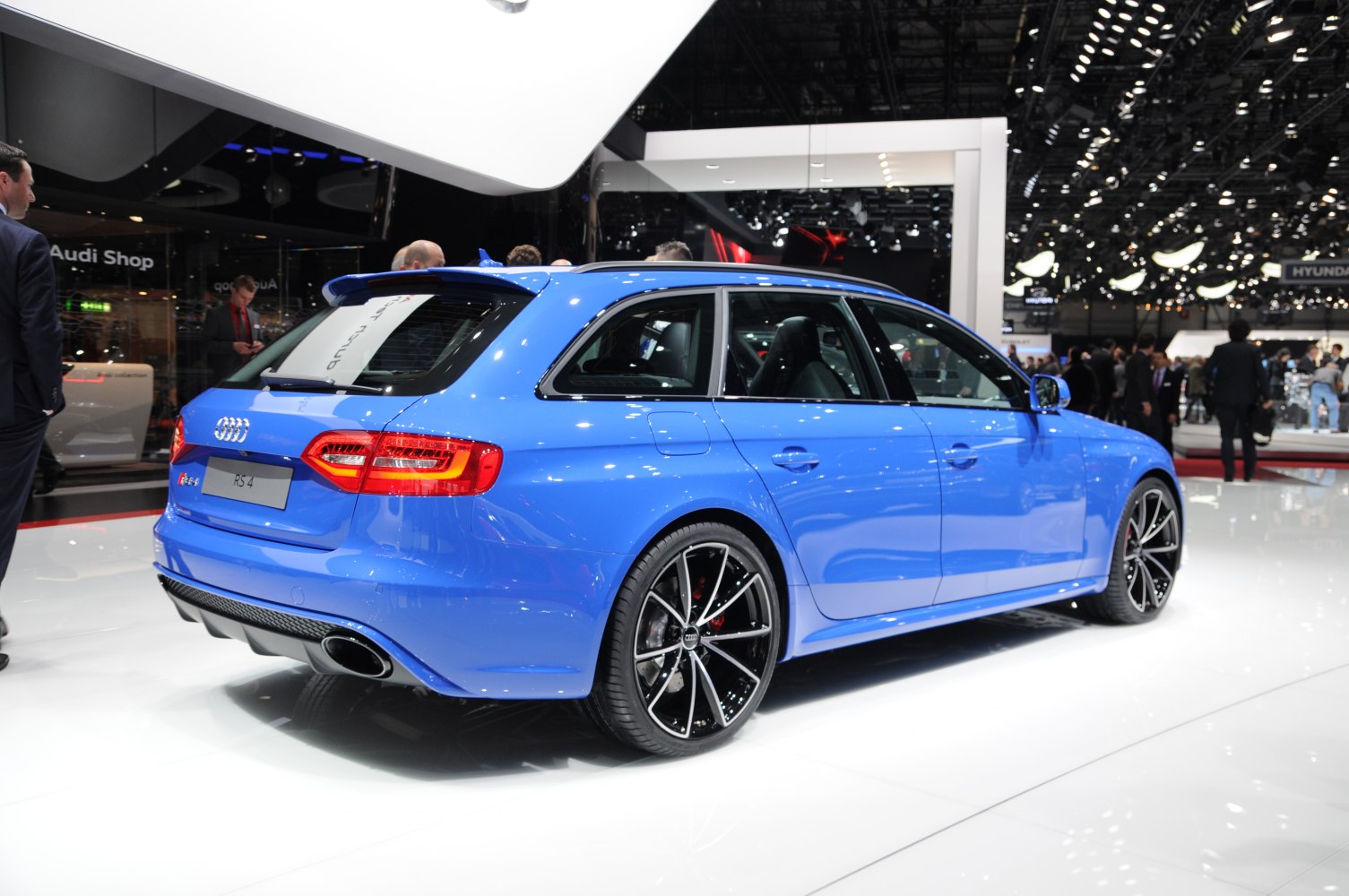 Blue sporty station wagon with alloy wheels and dual exhausts
