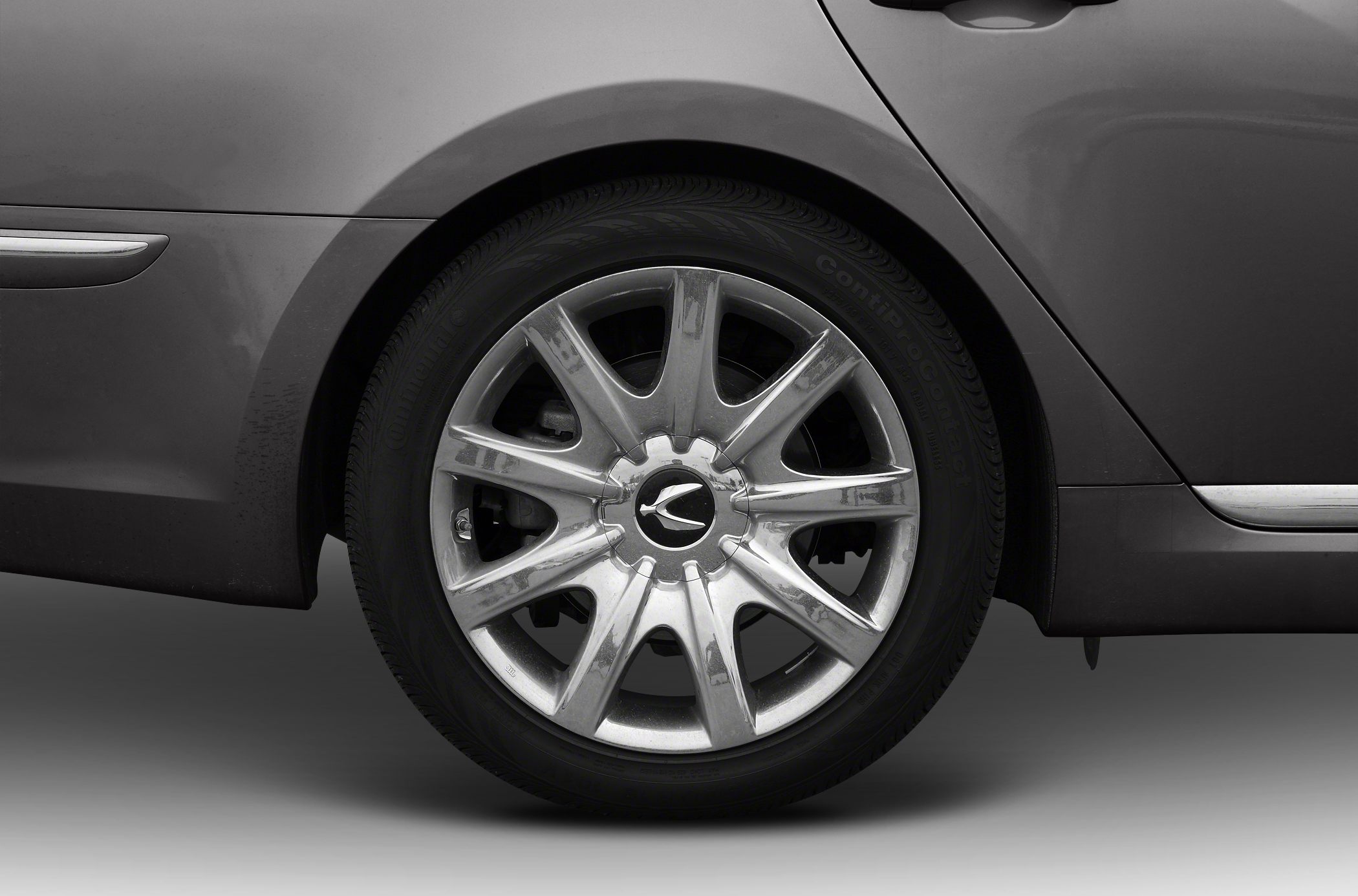 Close-up of alloy wheel and tire from luxury sedan