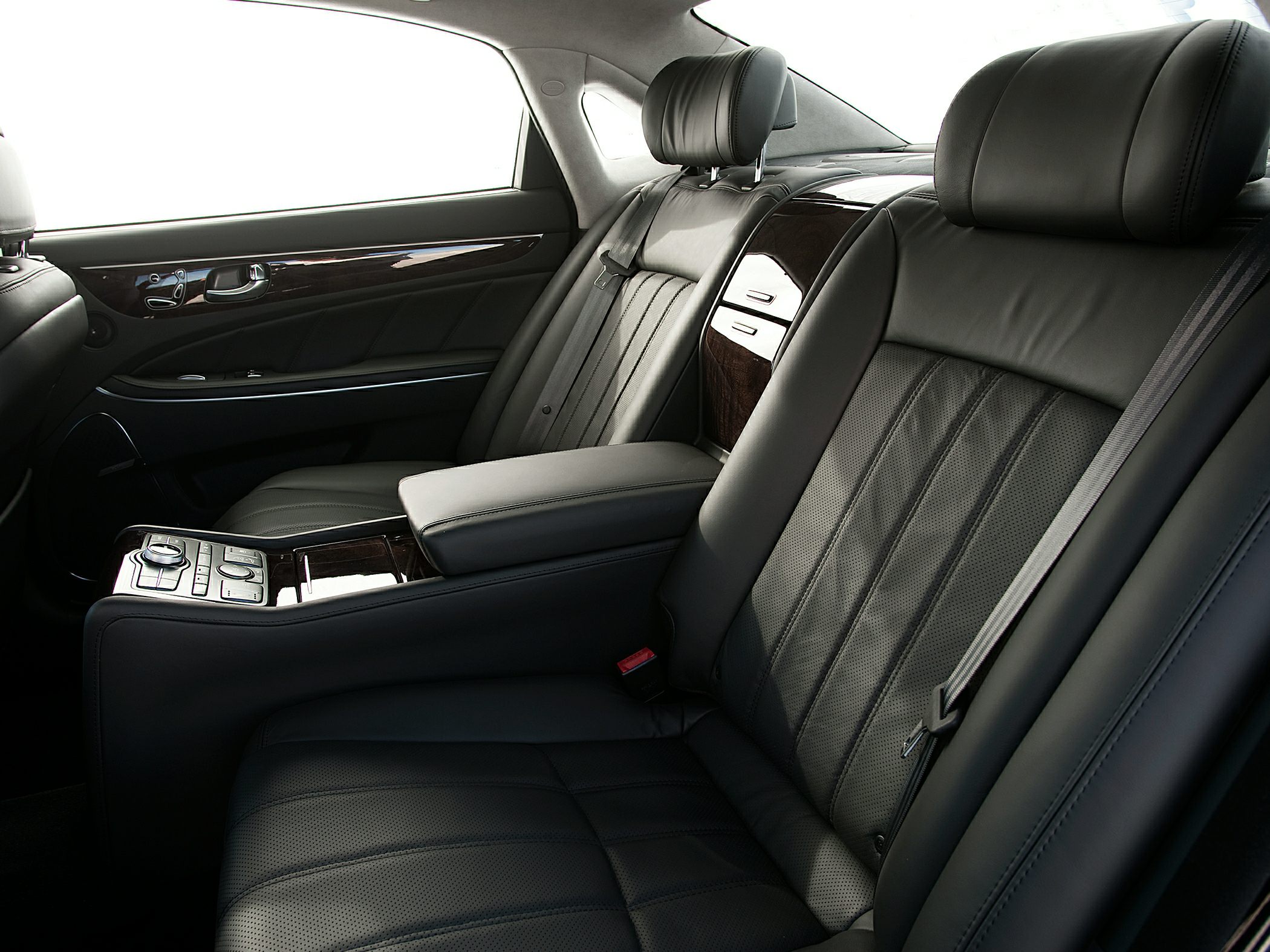 Luxury rear leather seats with wood trim and control panel