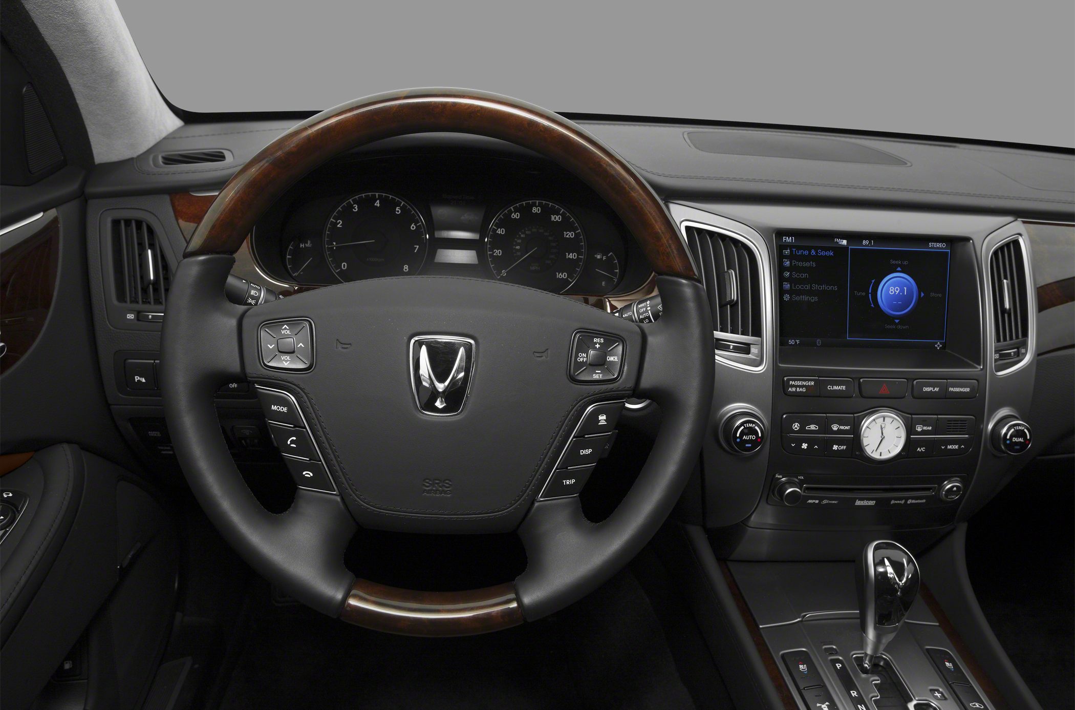 Wood-trimmed steering wheel and advanced center console controls