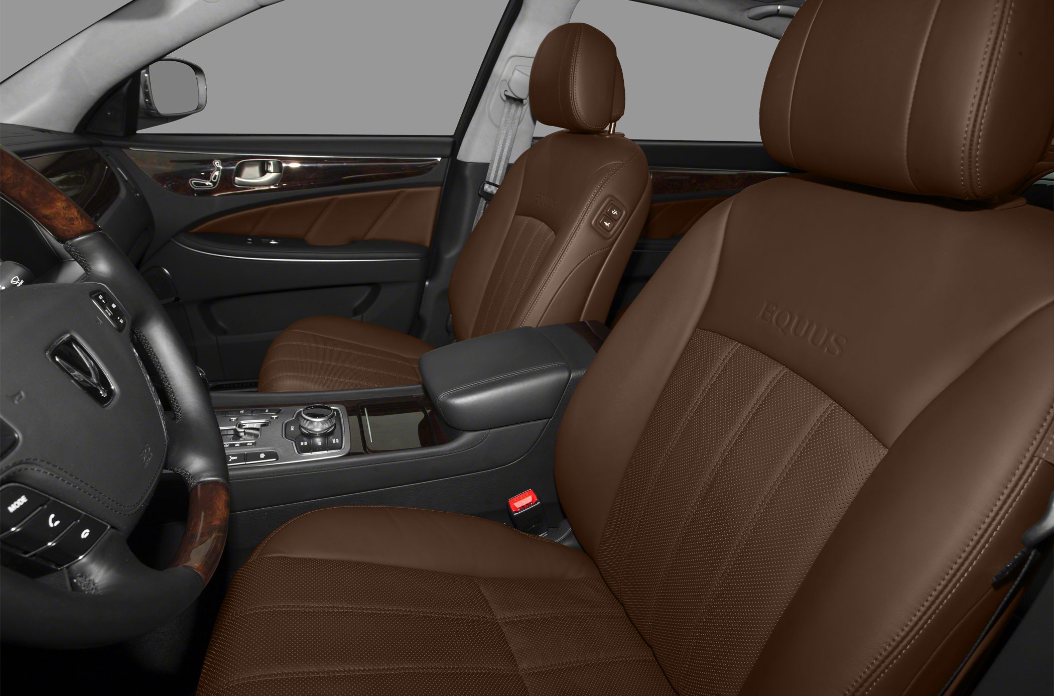 Luxurious brown leather seats and wood-trimmed dashboard interior