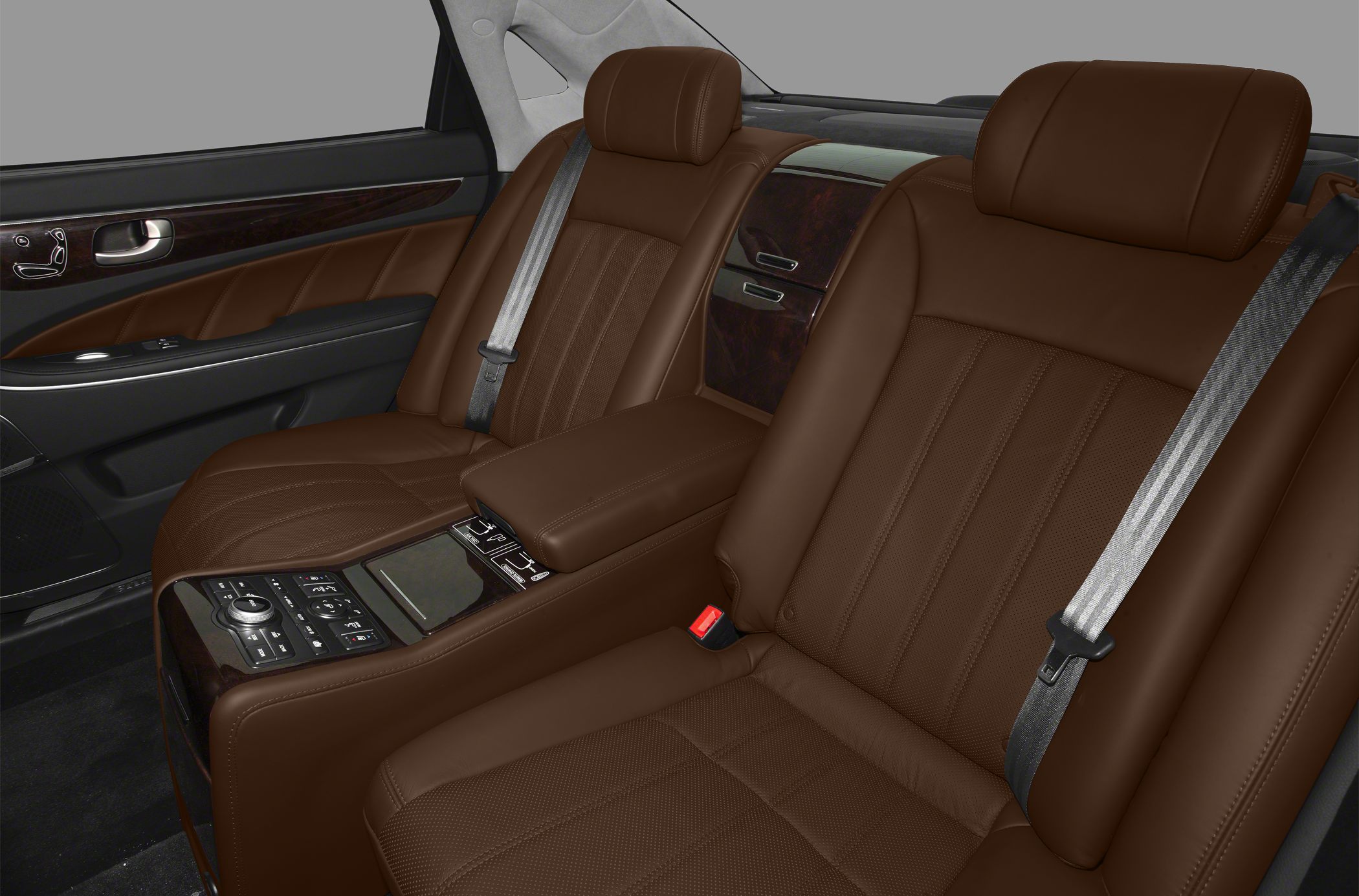 Brown leather rear seats with center console and wood trim panel