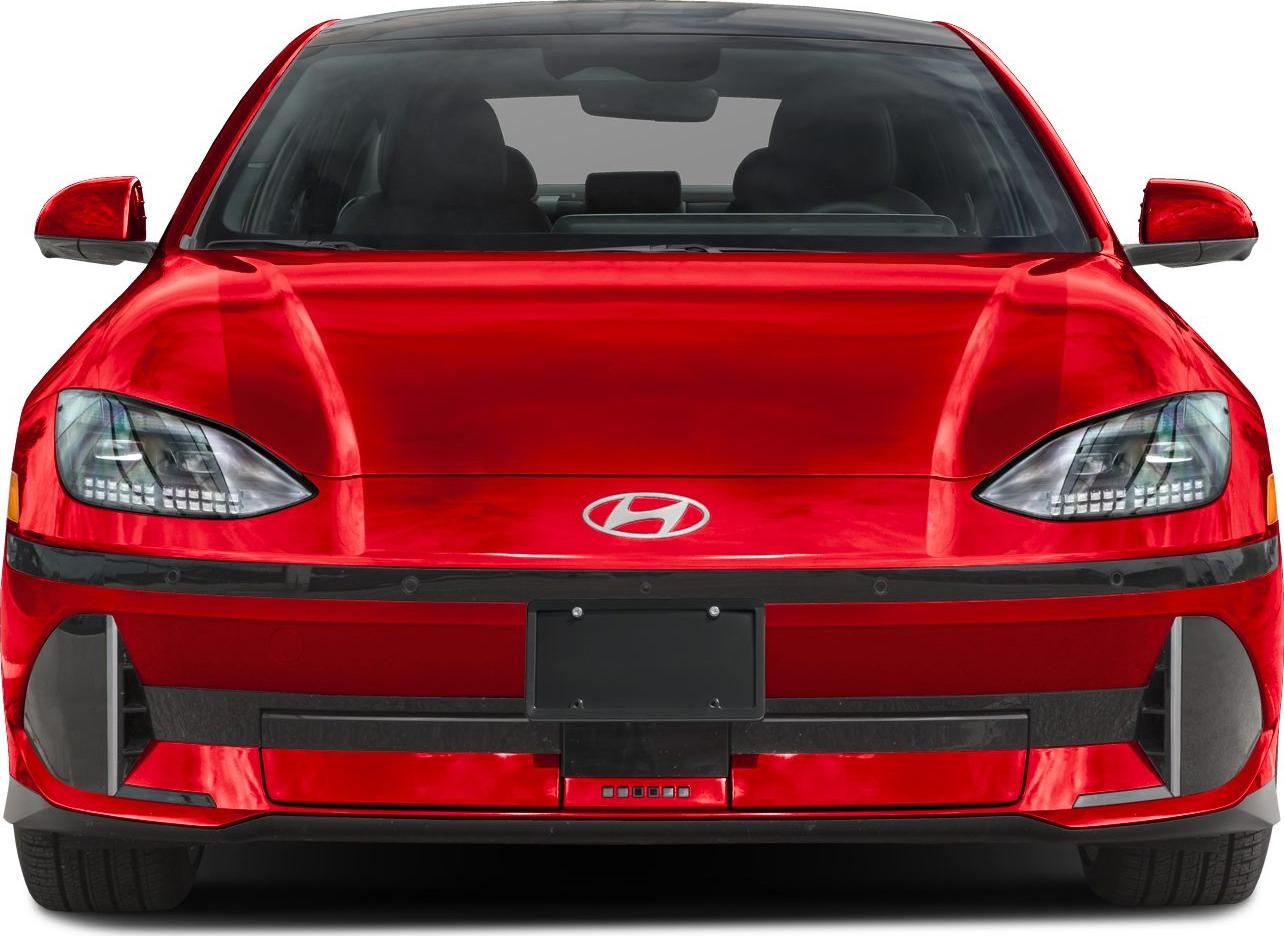 Front view of red electric sedan with LED headlights and aerodynamic design