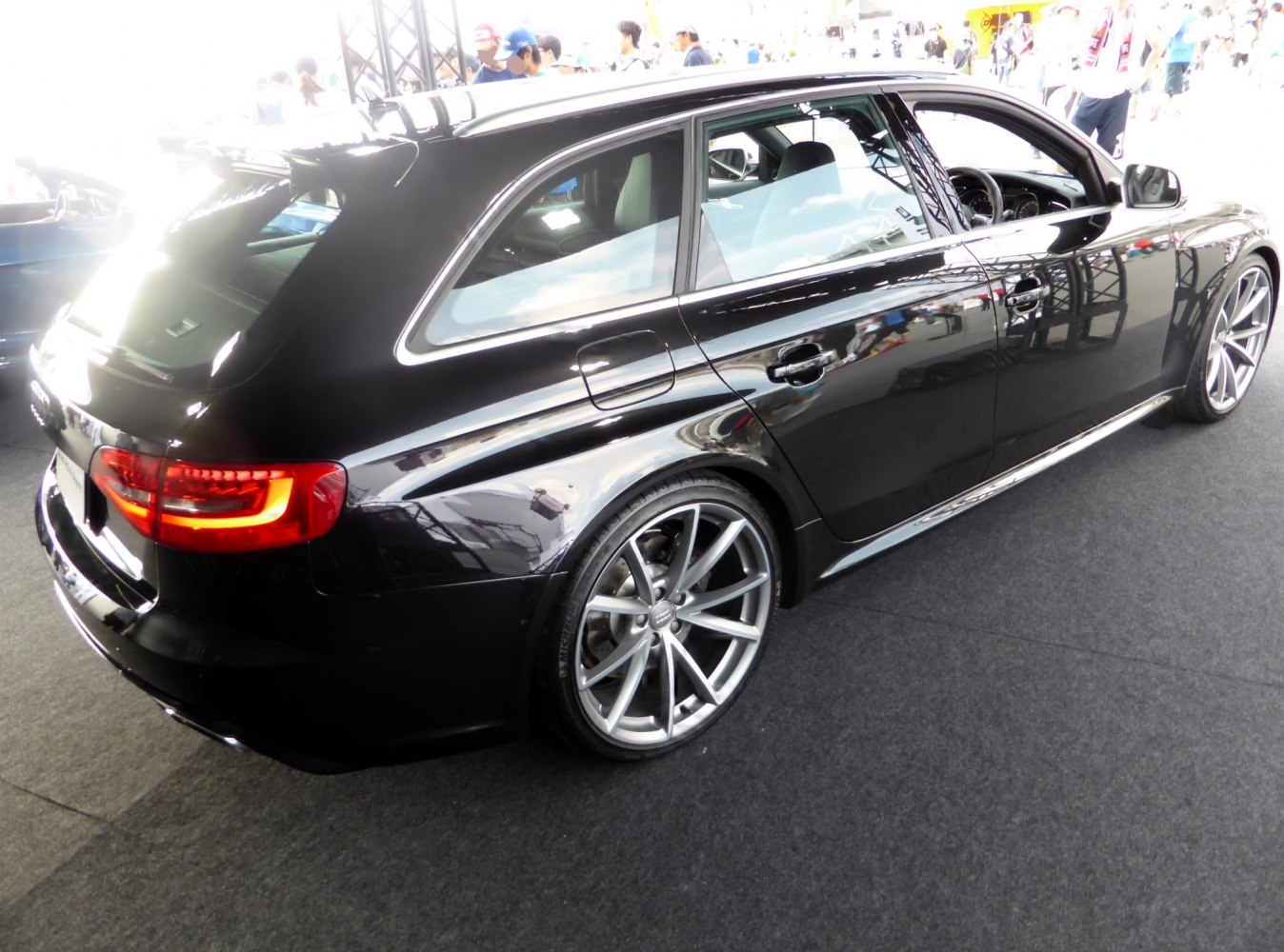 Rear side view of a black sporty wagon with LED tail lights