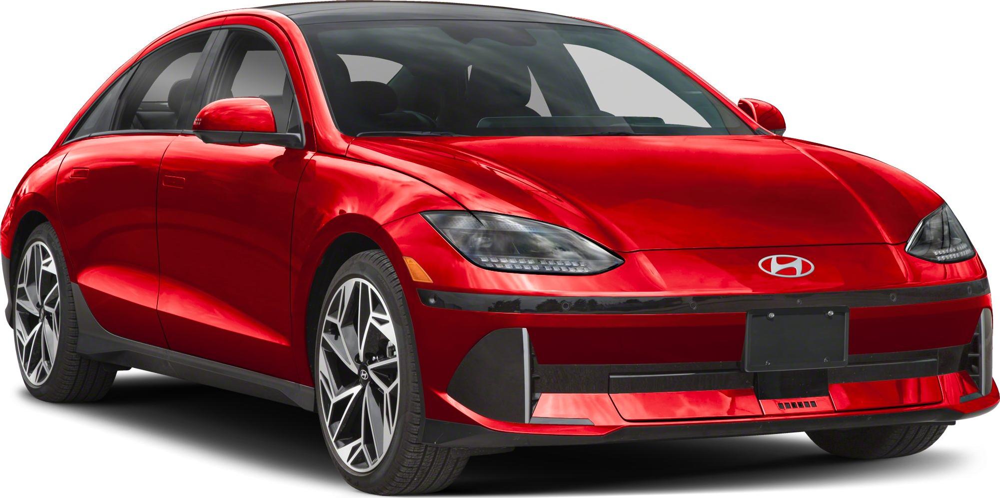Red electric sedan with aerodynamic body and LED headlights