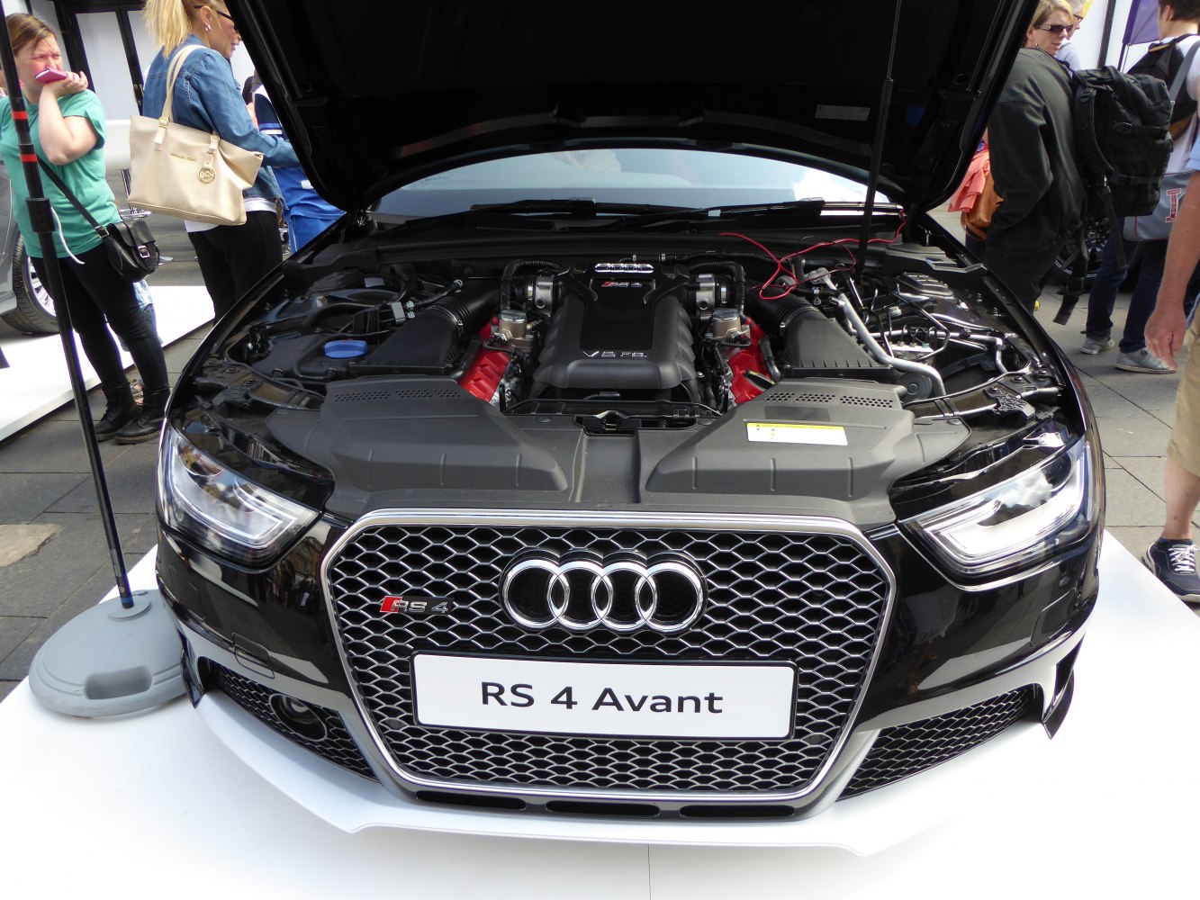 Audi RS 4 Avant front with open hood and visible V8 engine