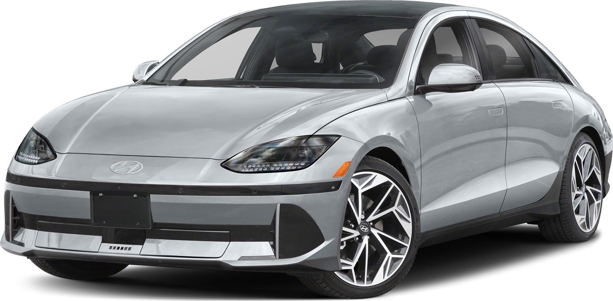 Front angled view of electric sedan with LED headlights and alloy wheels