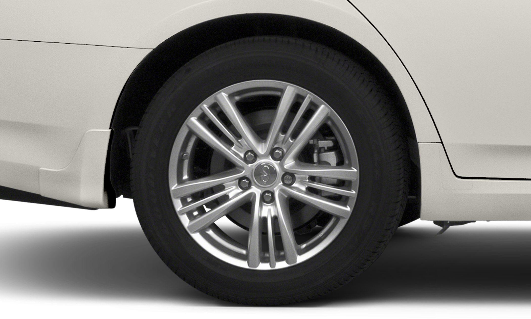 Multi-spoke alloy wheel with visible brake caliper on sedan