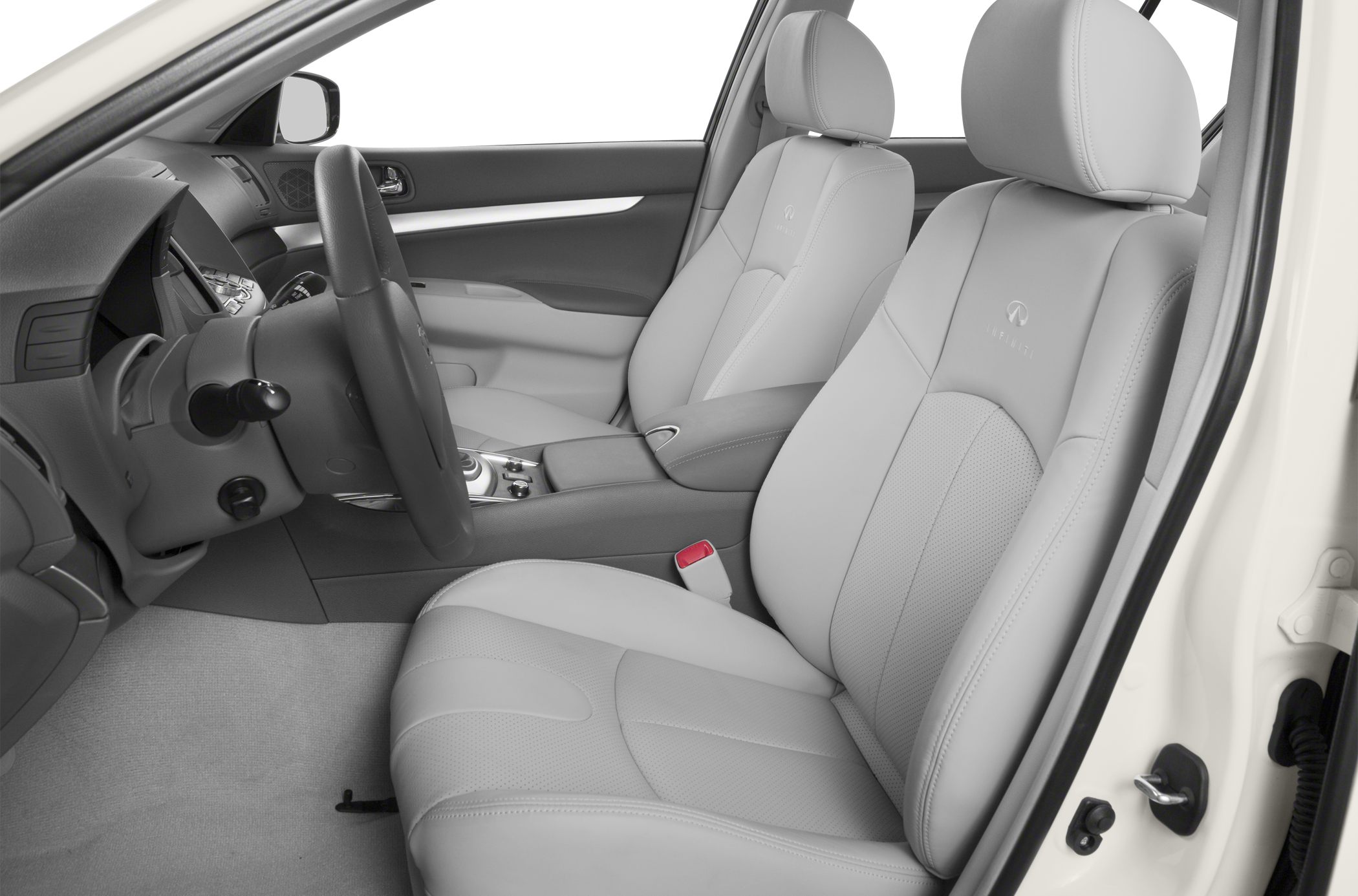 Light leather front seats and dashboard interior of a luxury sedan