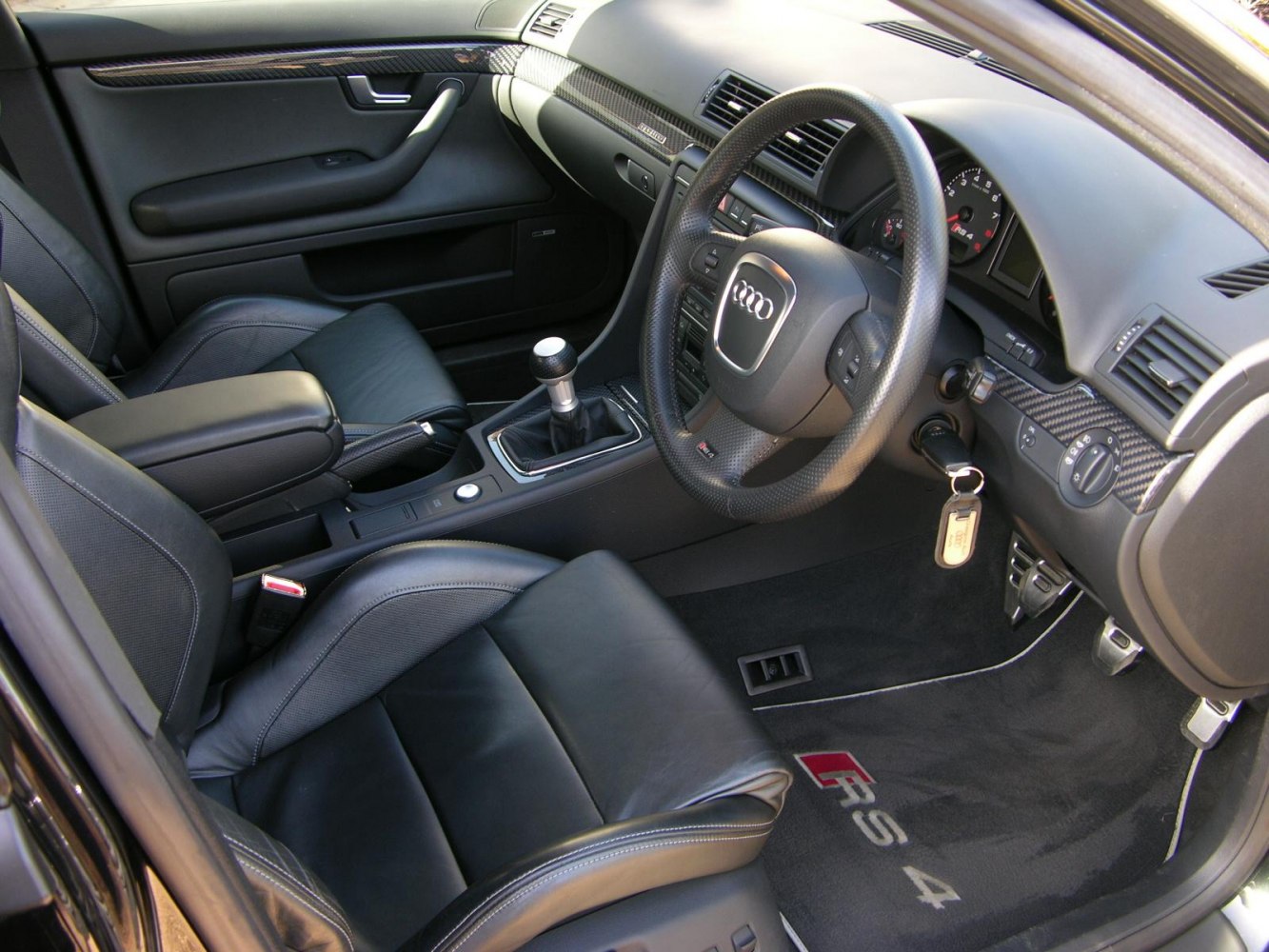 Manual transmission and premium leather seats in a sporty car interior