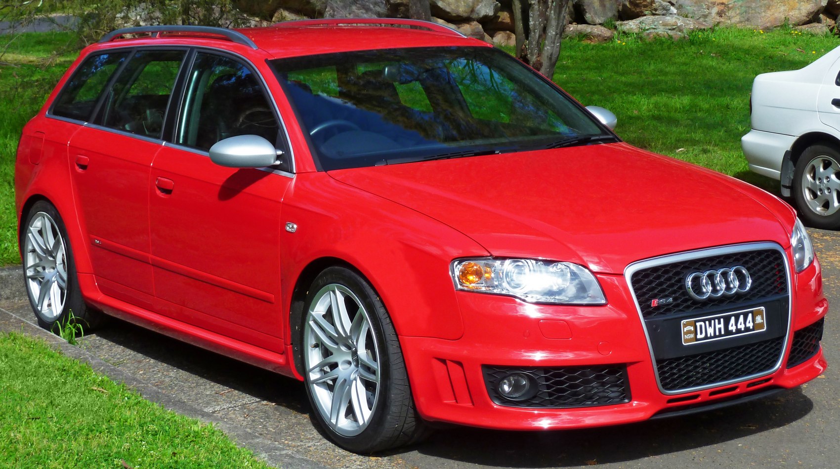 Red sports wagon with sporty alloy wheels and aerodynamic front end