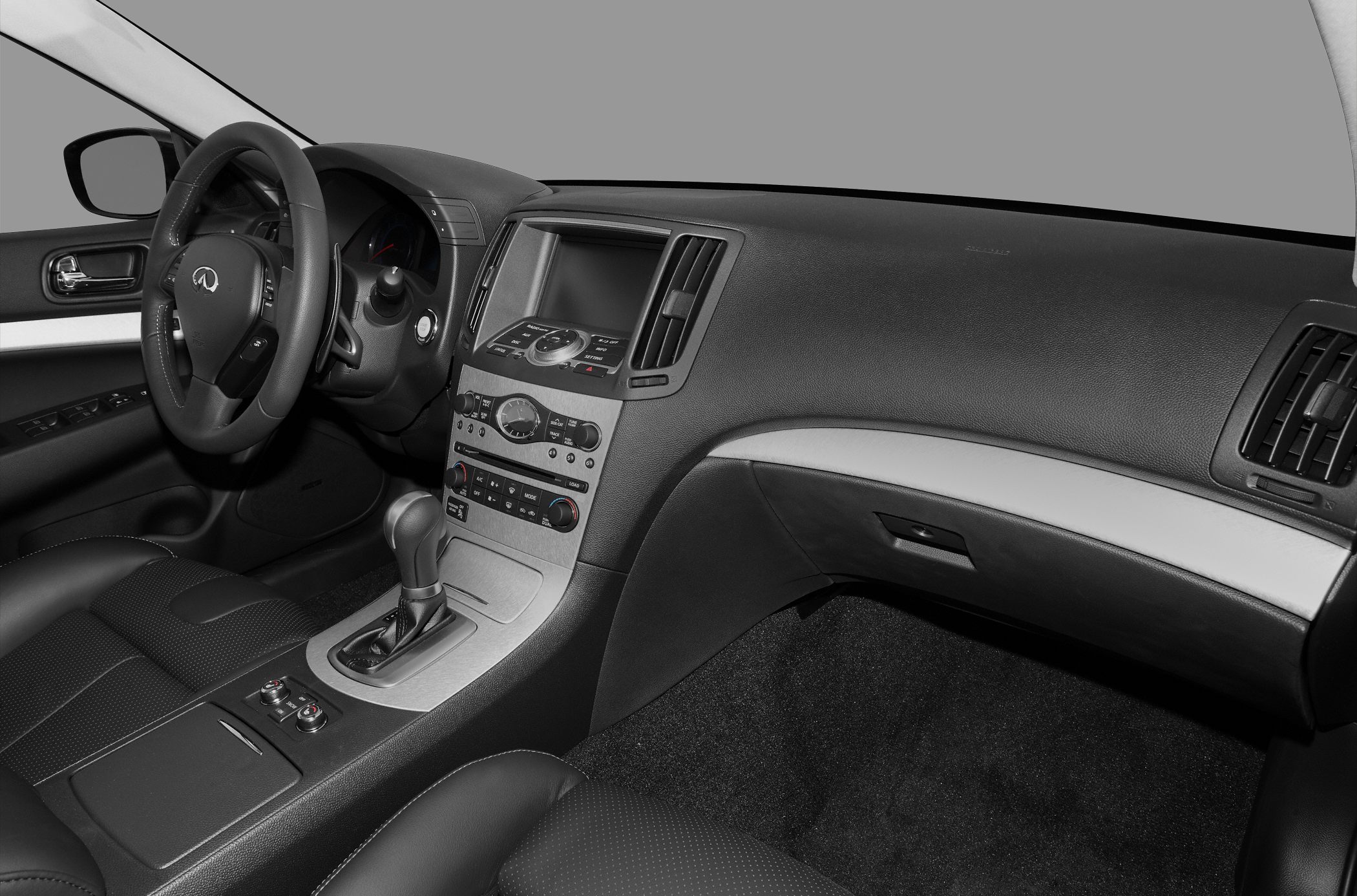 Luxury sedan interior with dashboard, center console, and steering wheel
