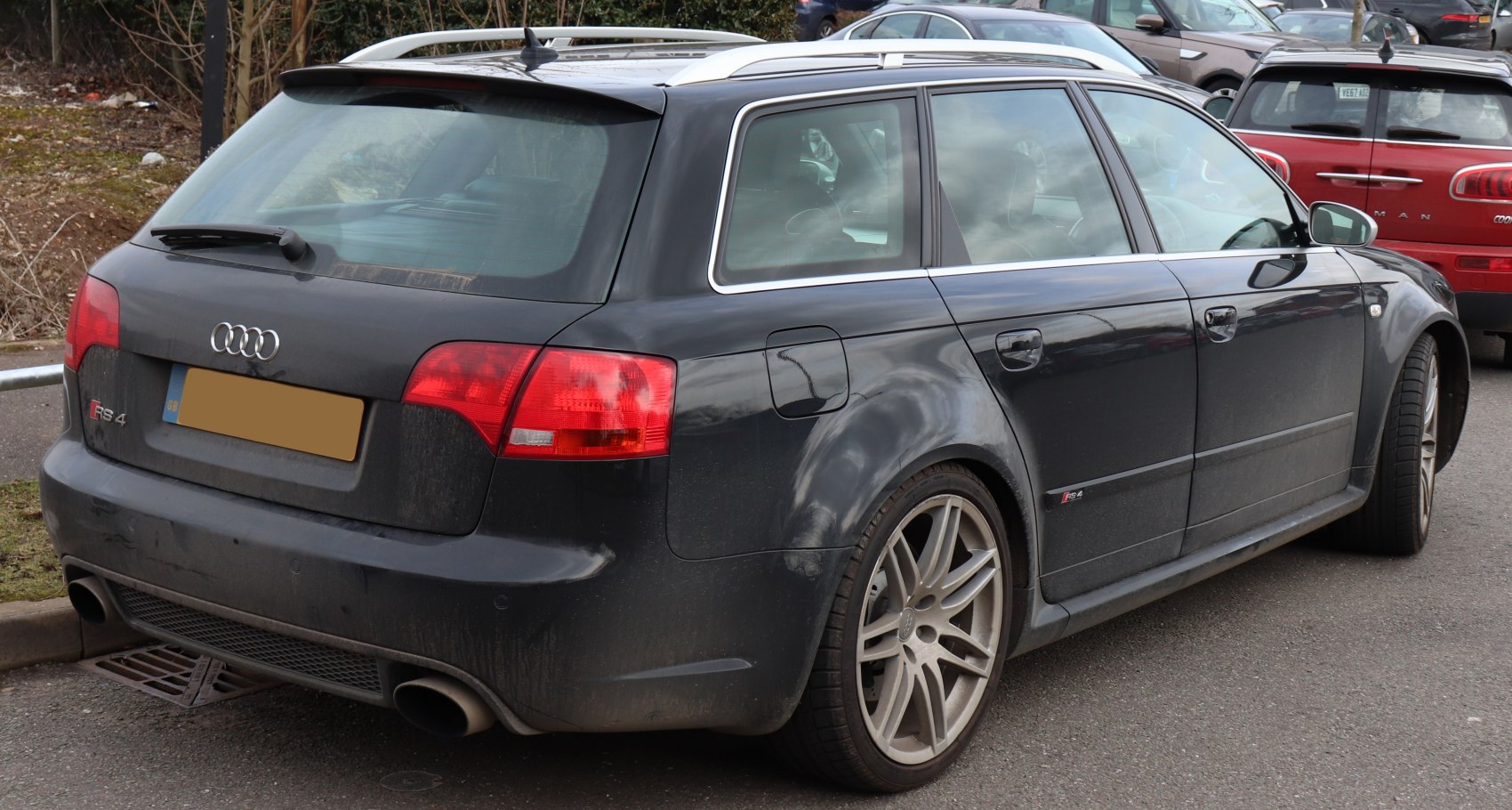 Rear and side view of a high-performance station wagon with wide arches and dual exhaust.