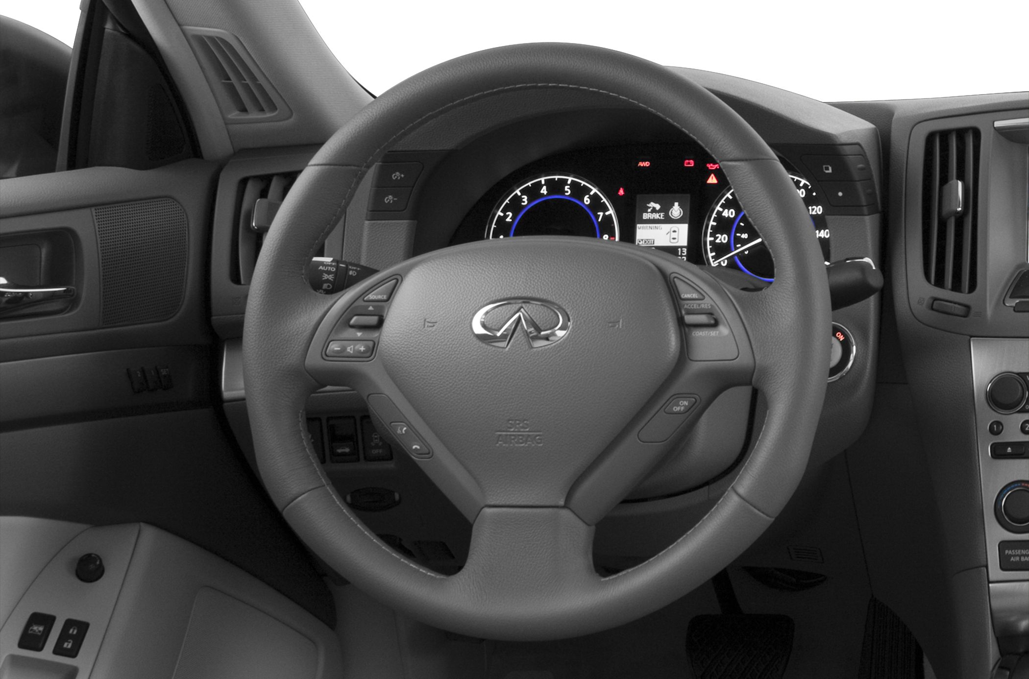 Close-up of steering wheel and instrument cluster with dashboard controls