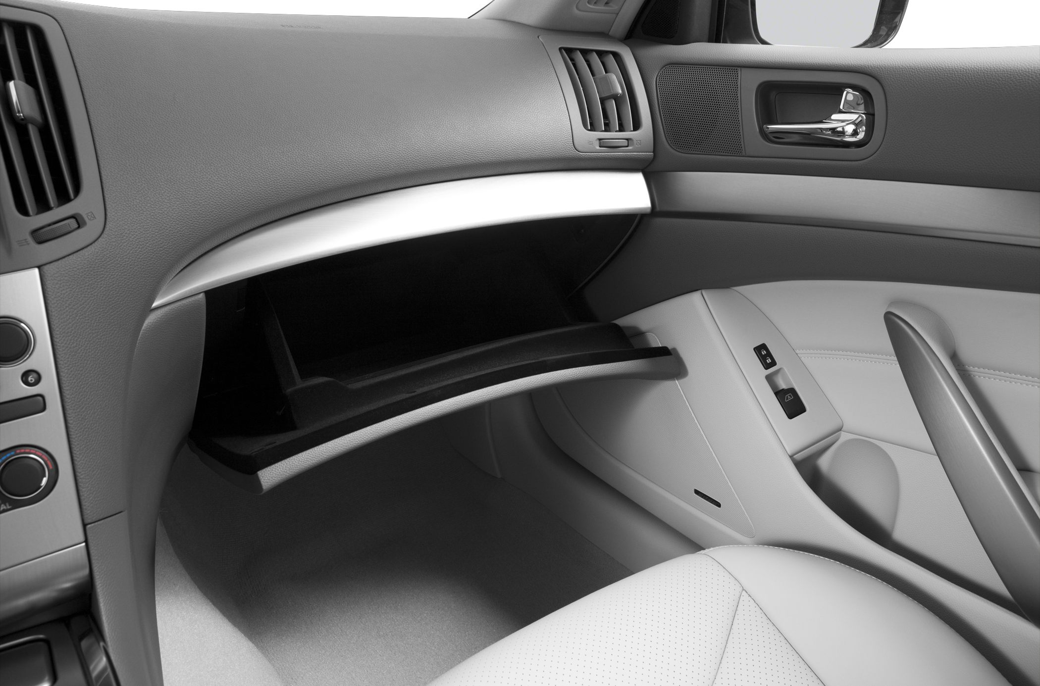 Open glove box and passenger door panel with control buttons