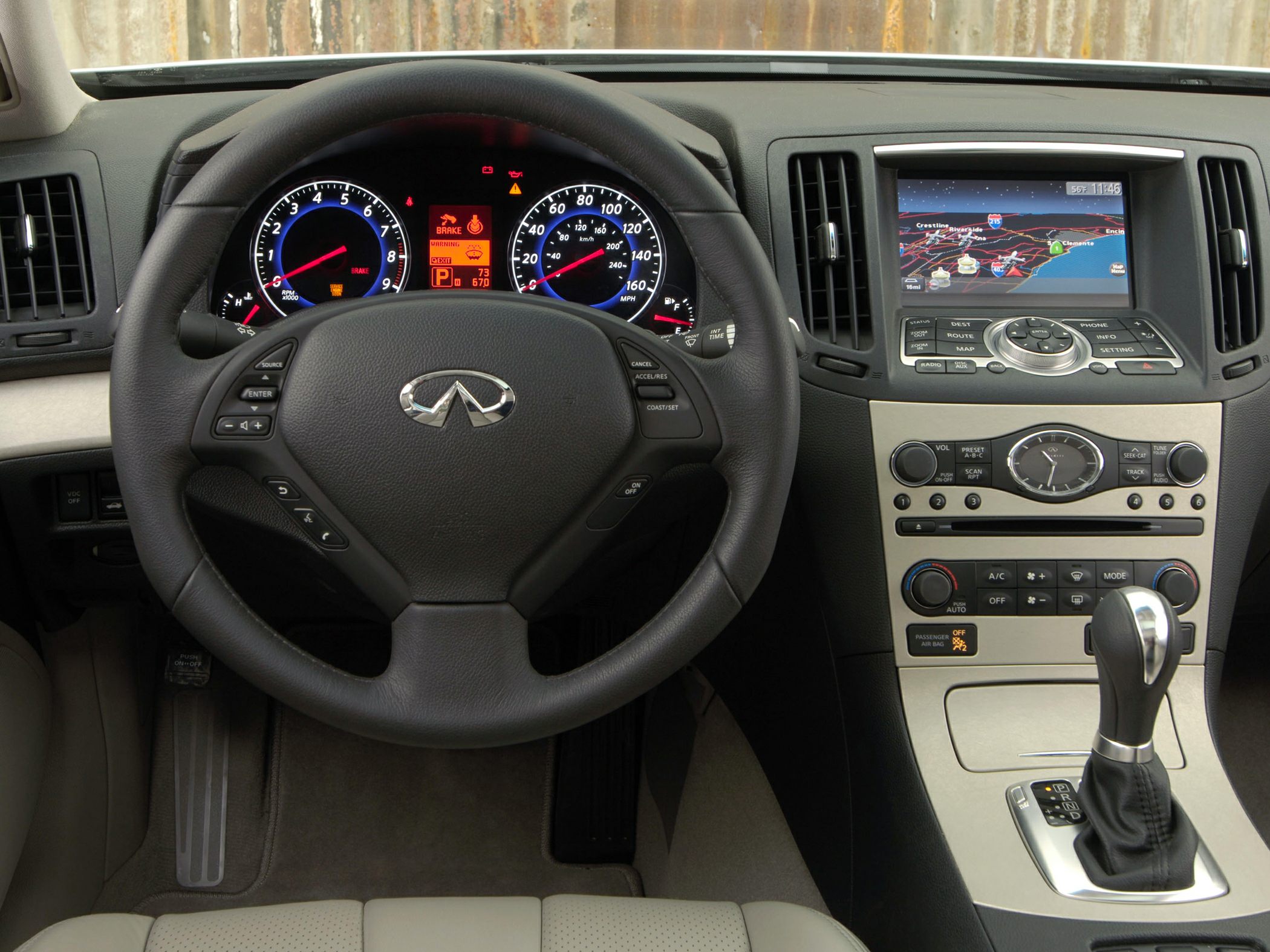 Digital instrument cluster and navigation screen in luxury sedan interior
